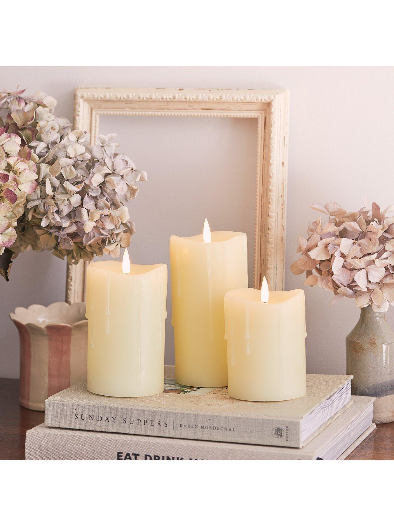  image of lights4fun-truglow-dripping-wax-led-pillar-candle-trio