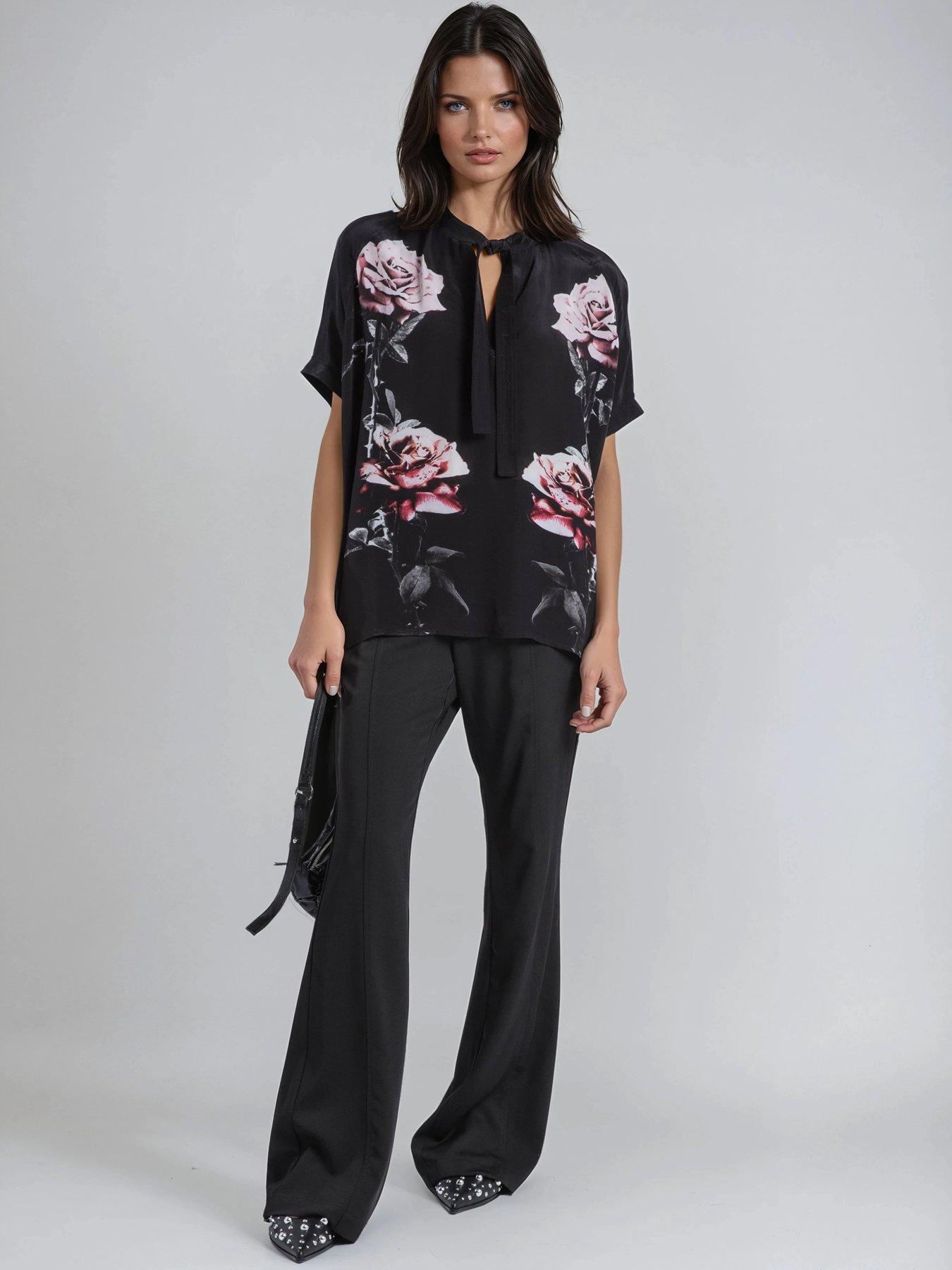  image of religion-loose-rose-heart-tie-neck-floral-back-placement-blouse-black