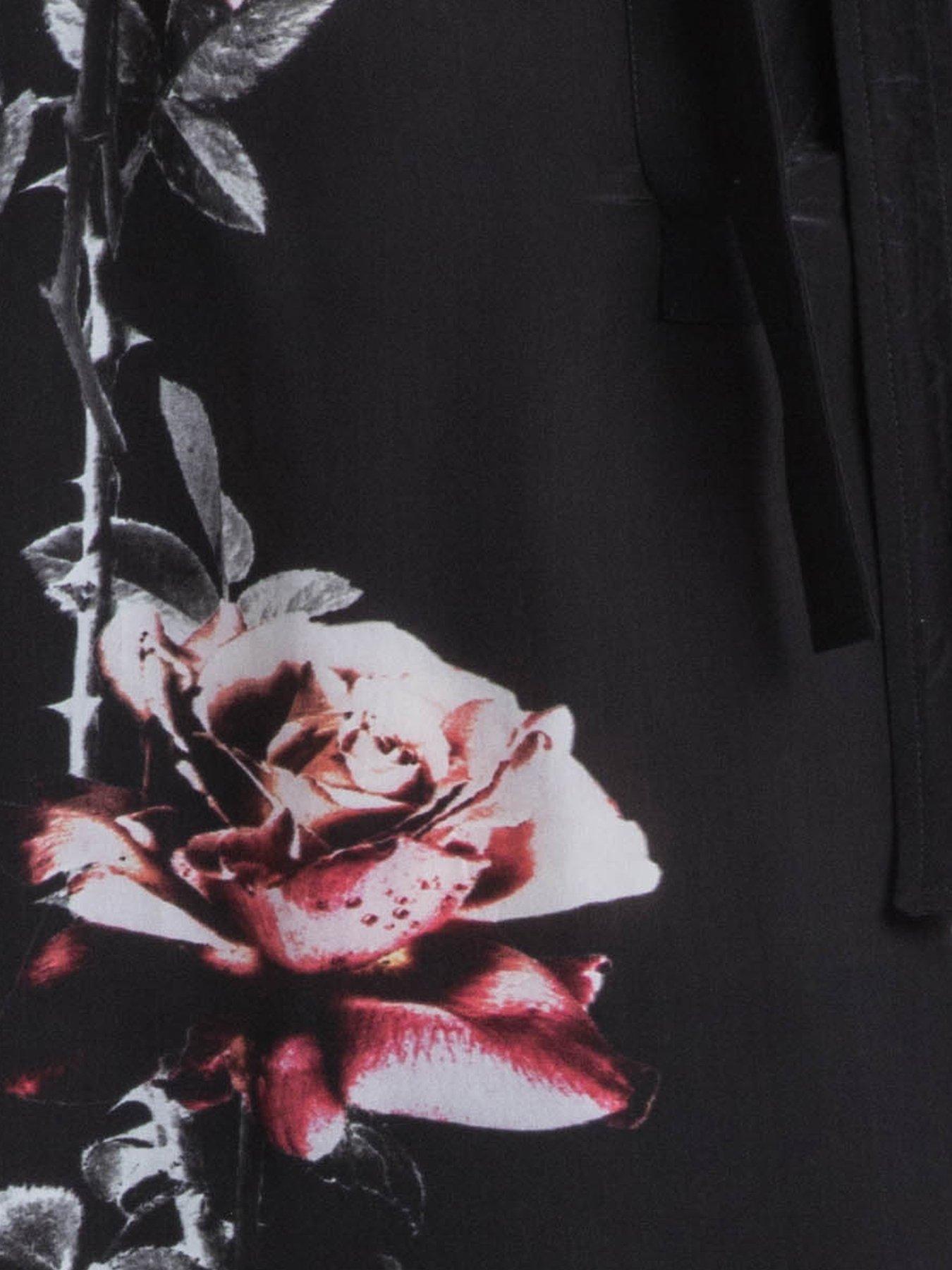  image of religion-loose-rose-heart-tie-neck-floral-back-placement-blouse-black