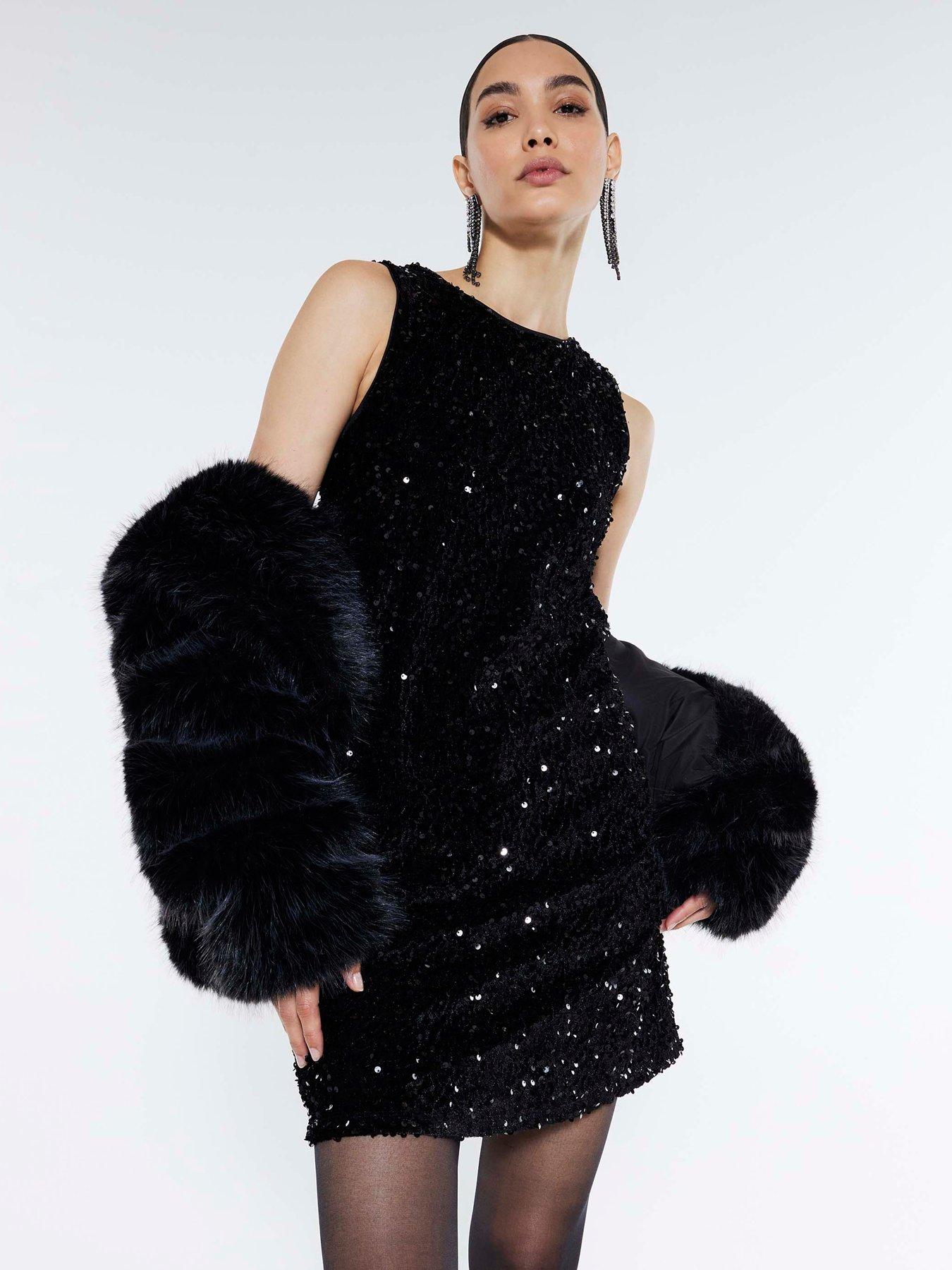 front image of river-island-velvet-sequin-bow-back-mini-dress-black