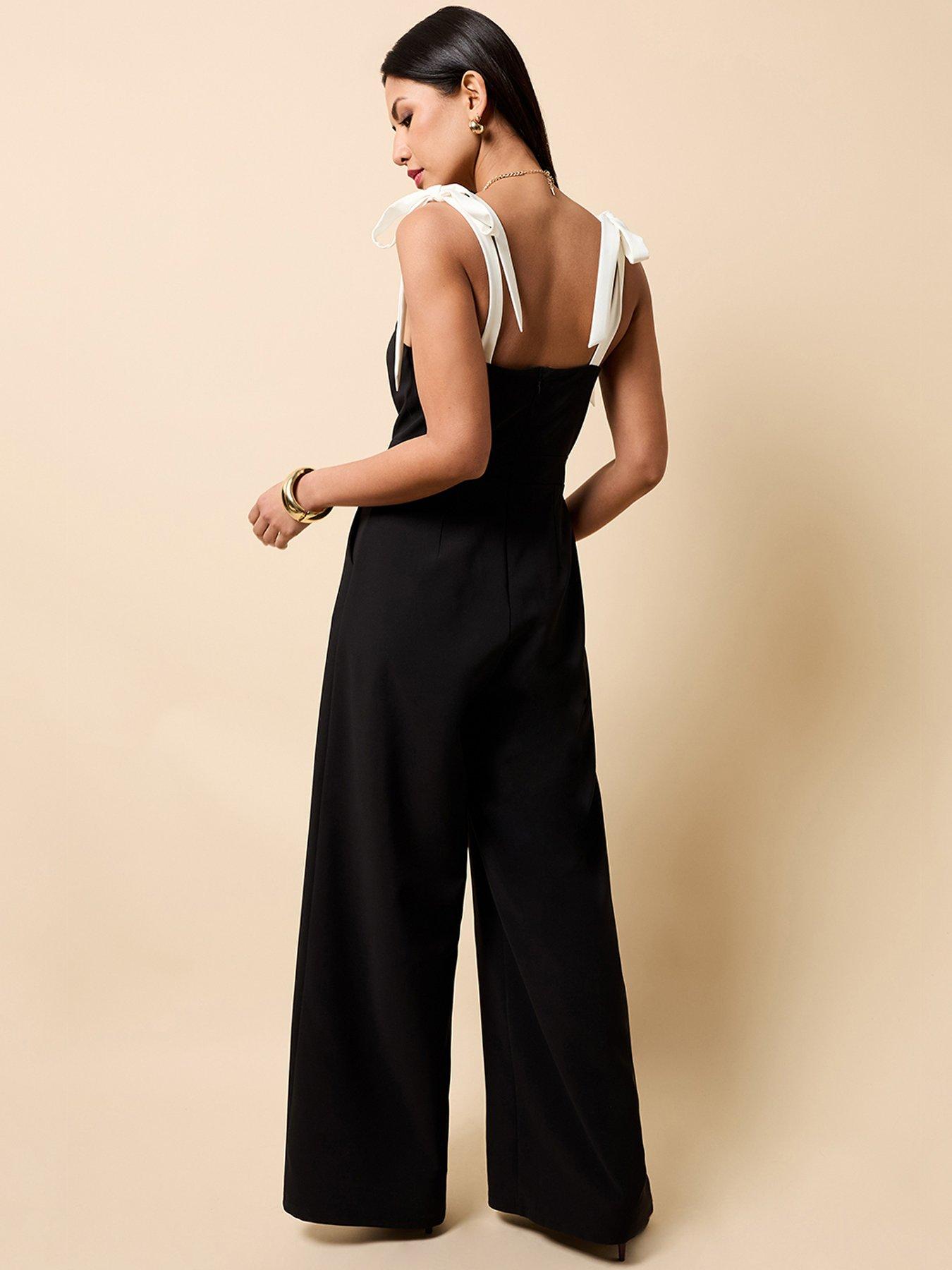 Image 2 of 4 of Little Mistress Black Contrast Shoulder Bow Jumpsuit