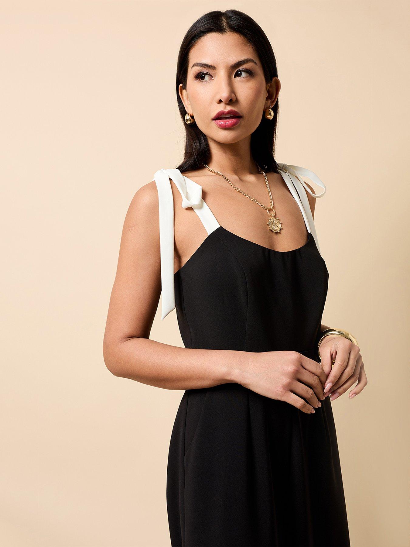 Image 4 of 4 of Little Mistress Black Contrast Shoulder Bow Jumpsuit