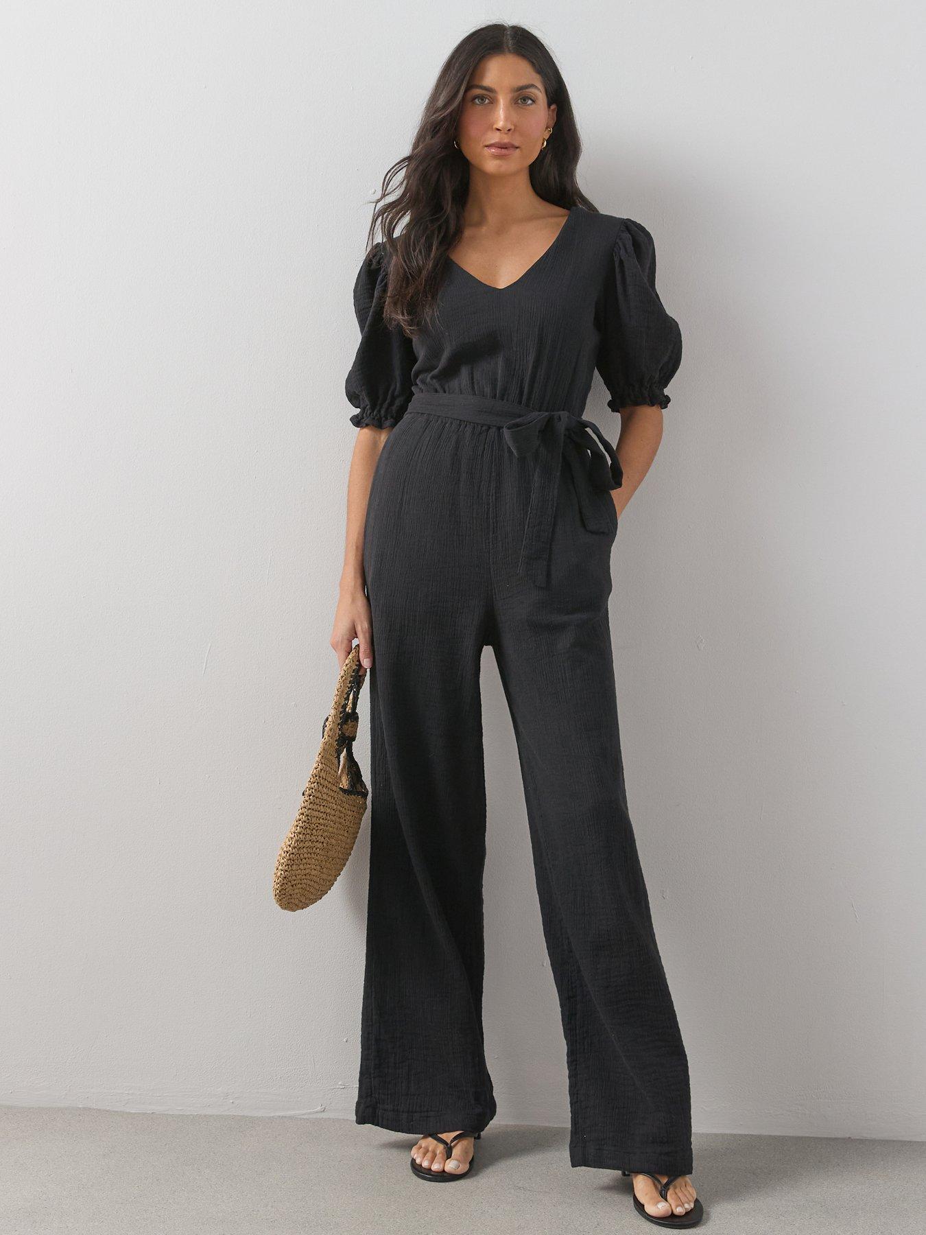 Image 1 of 7 of The Very Collection Cheese Cloth Puff Sleeve Belted Jumpsuit - Black