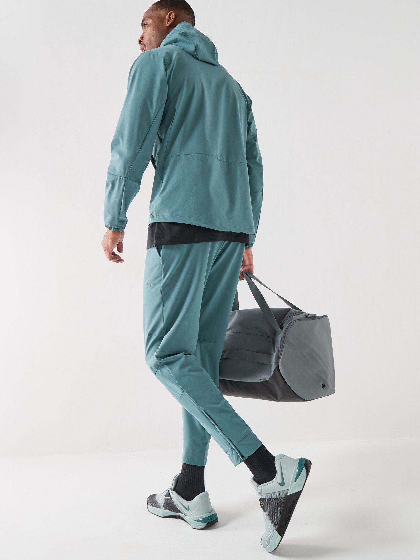 Image 3 of 7 of Nike Mens Training Dri-FIT Zippered Cuff Versatile Pants - Green