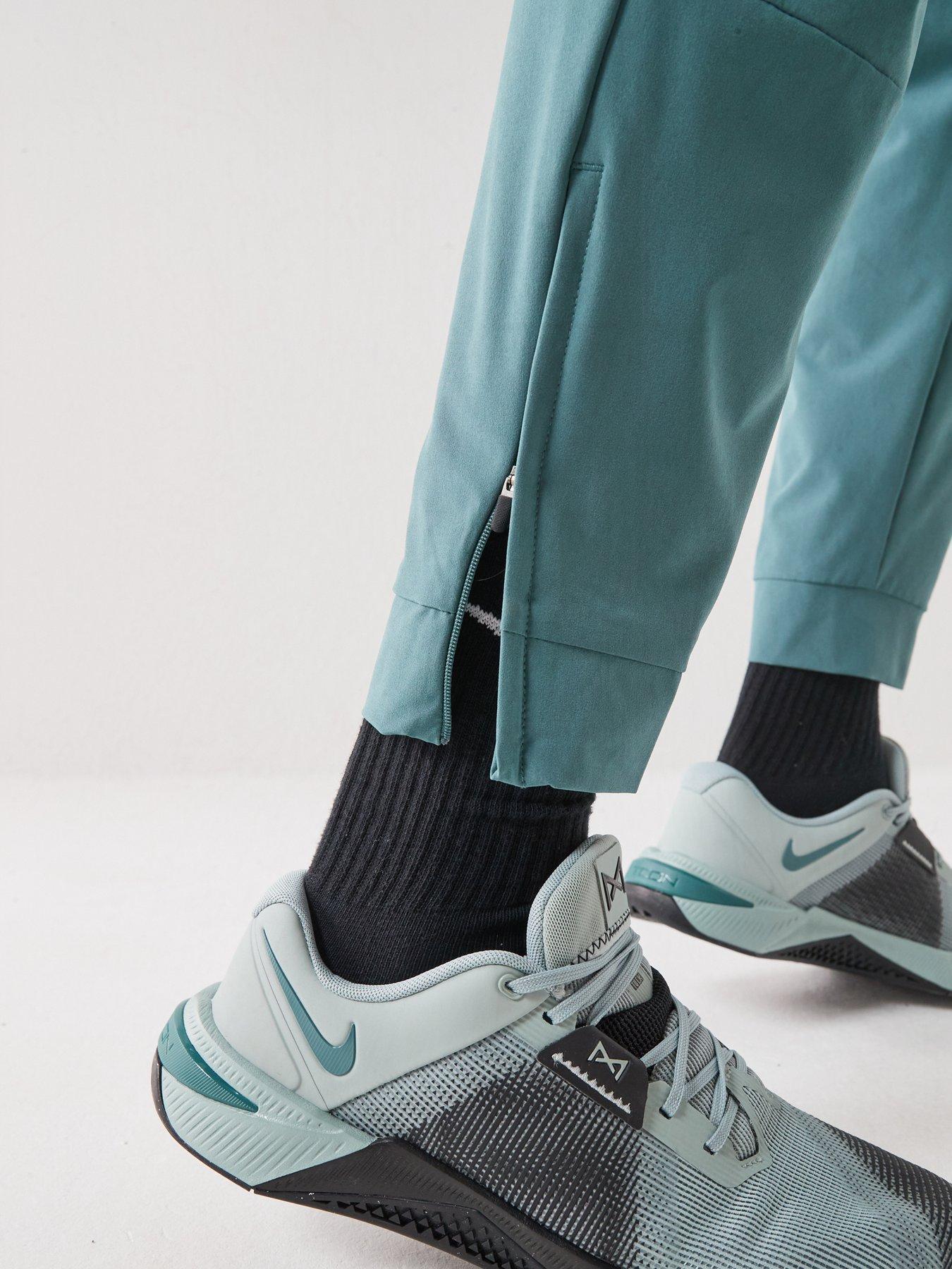Image 6 of 7 of Nike Mens Training Dri-FIT Zippered Cuff Versatile Pants - Green