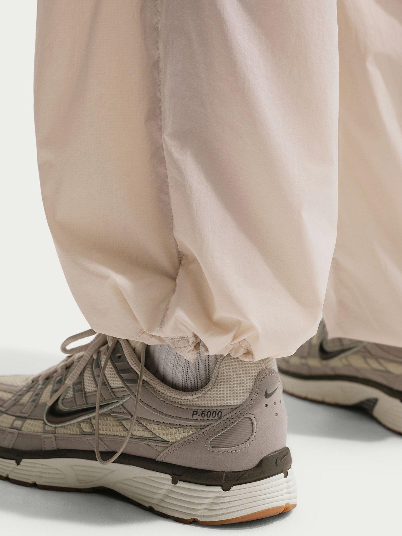  image of nike-mens-windrunner-lightweight-uv-pants-brown