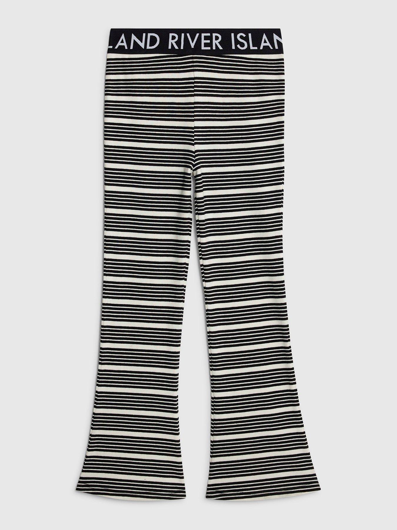 Image 1 of 4 of River Island Older Girls Stripe Waistband Flared Trousers - Black