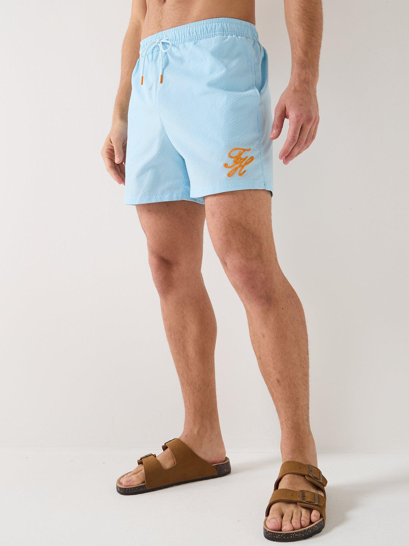 Image 1 of 6 of Tommy Hilfiger Mono Script Ithaca Medium Swim Shorts - Blue