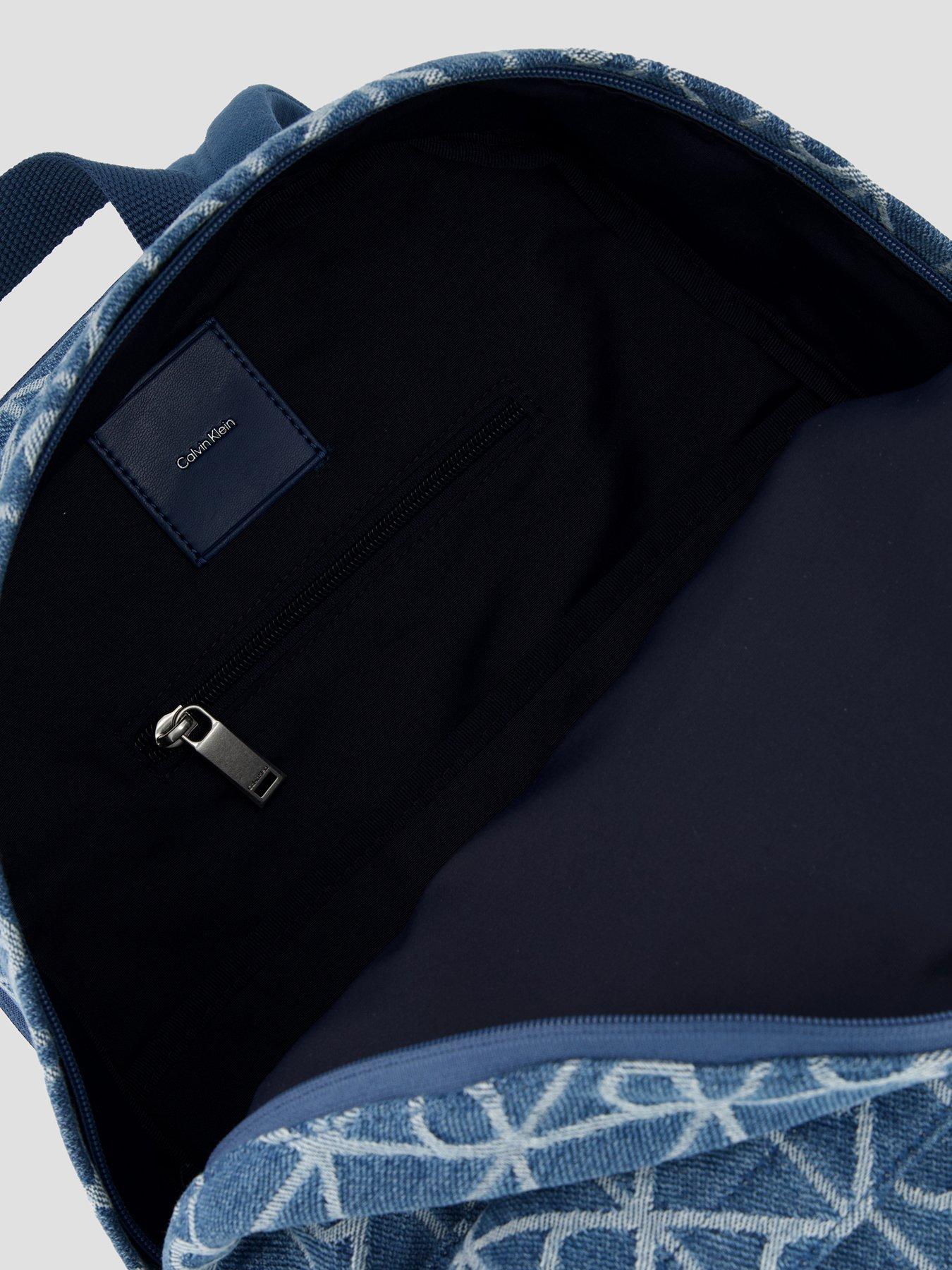Image 4 of 4 of Calvin Klein Emblem Allover Print Denim Round Backpack - Blue