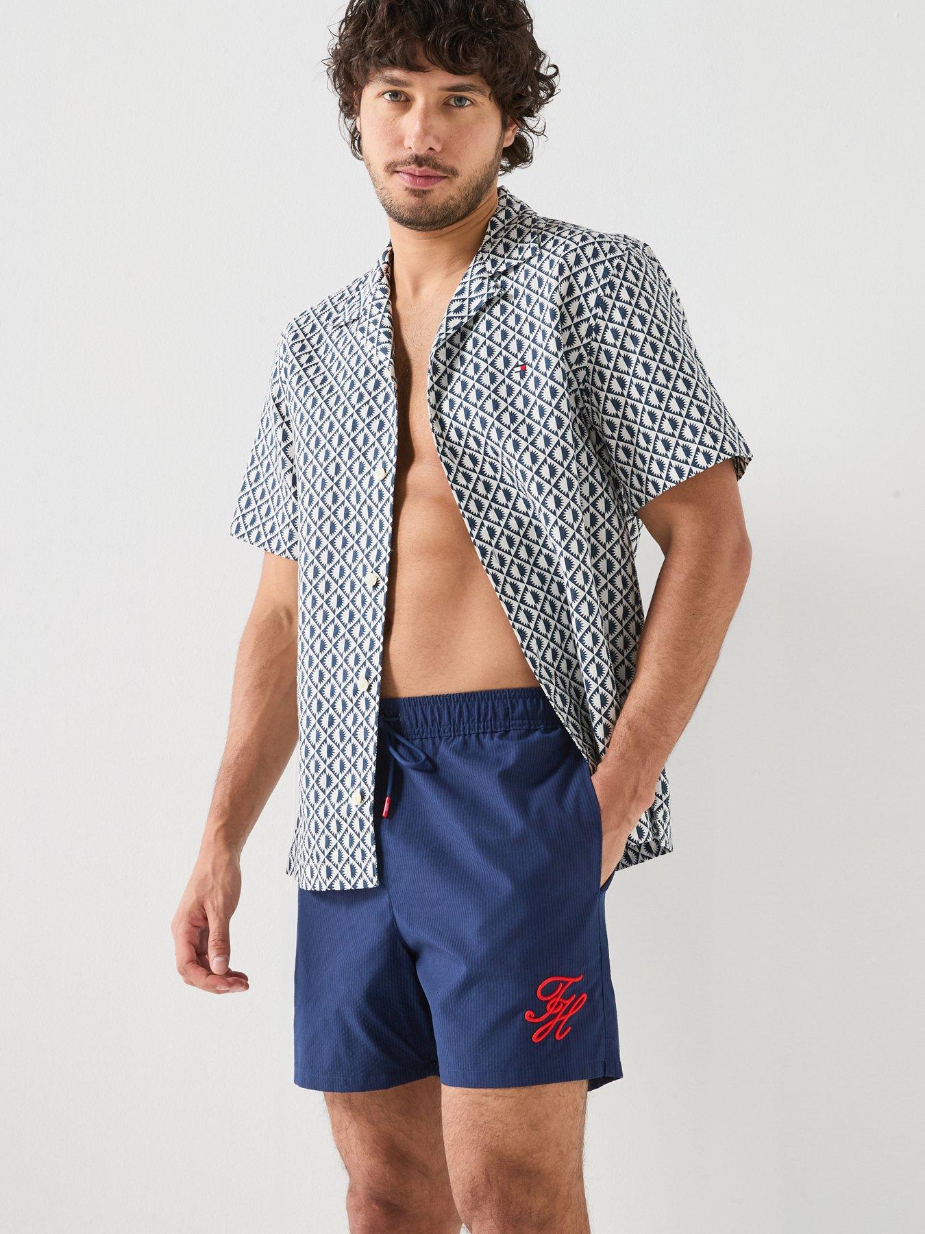 Image 1 of 6 of Tommy Hilfiger Mono Script Ithaca Medium Swim Shorts - Navy