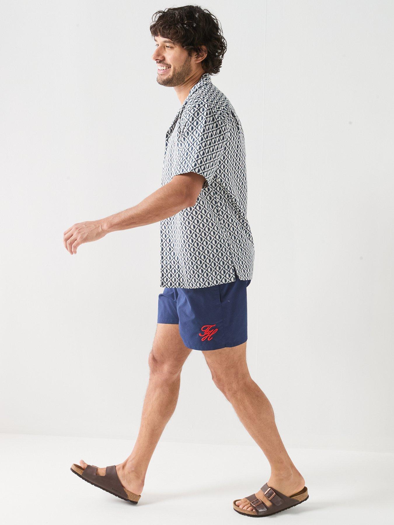 Image 6 of 6 of Tommy Hilfiger Mono Script Ithaca Medium Swim Shorts - Navy