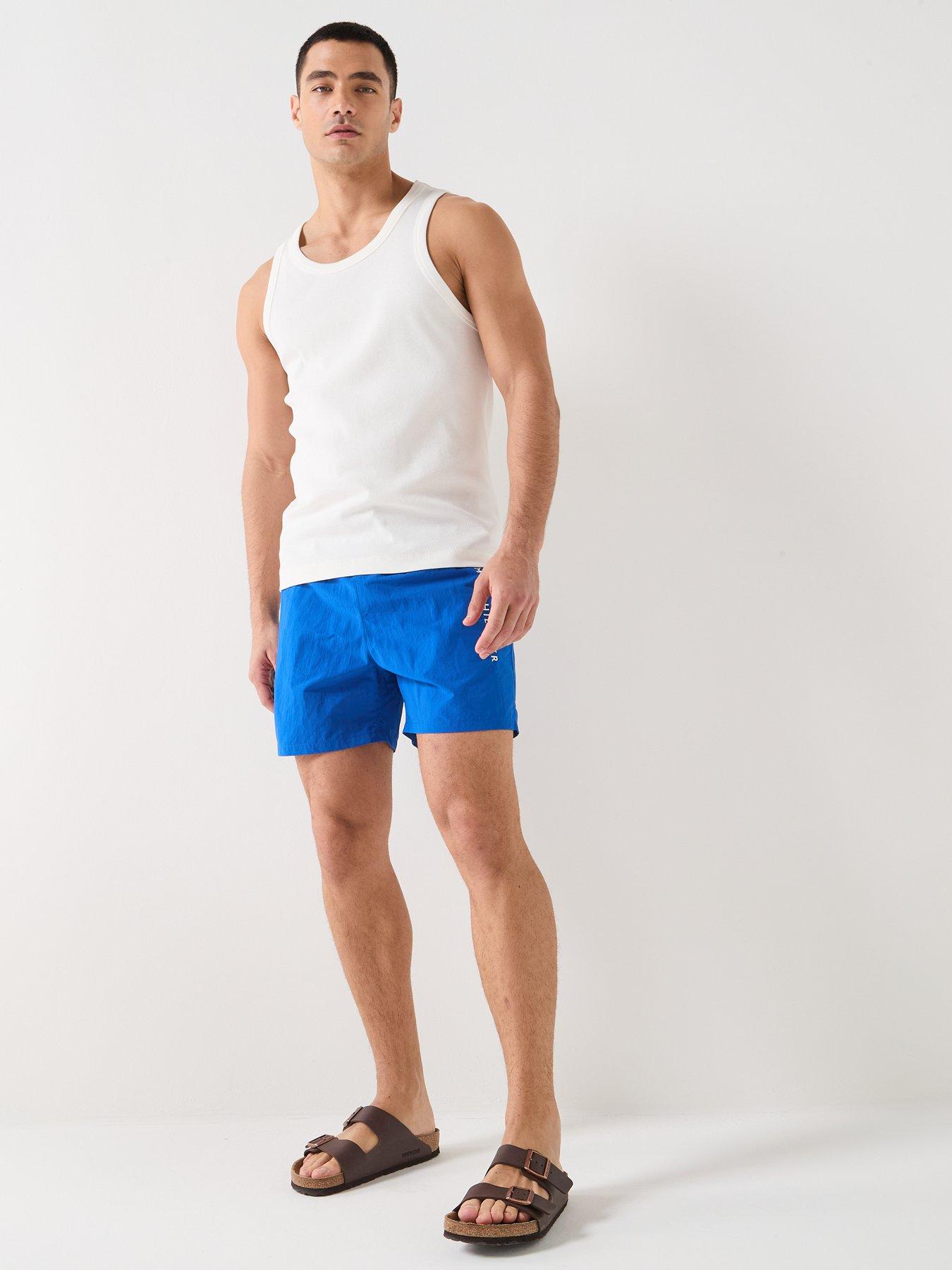  image of tommy-hilfiger-side-linear-logo-swimshorts-blue