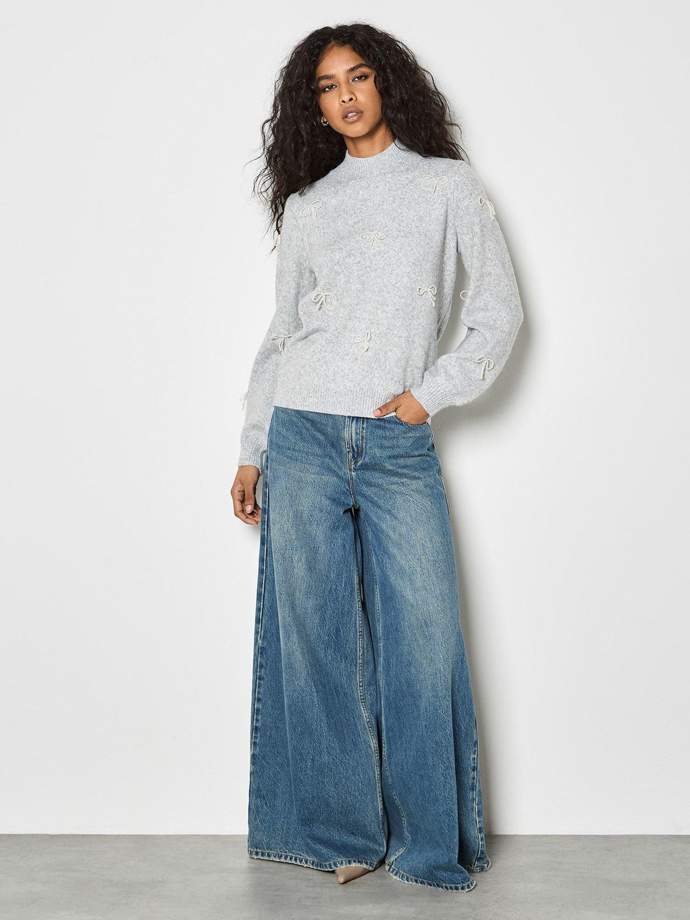  image of apricot-pearl-bows-jumper