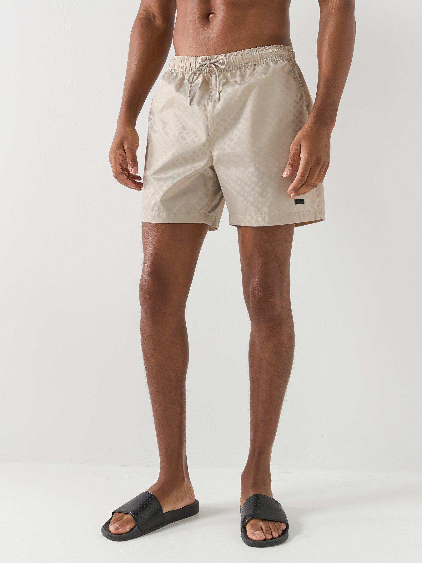 front image of boss-jacques-jacquard-monogram-swim-shorts-light-beige