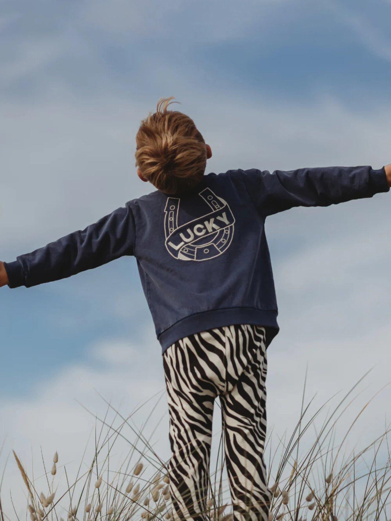 front image of turtledove-london-kids-cotton-lucky-embroidered-jacket-blue