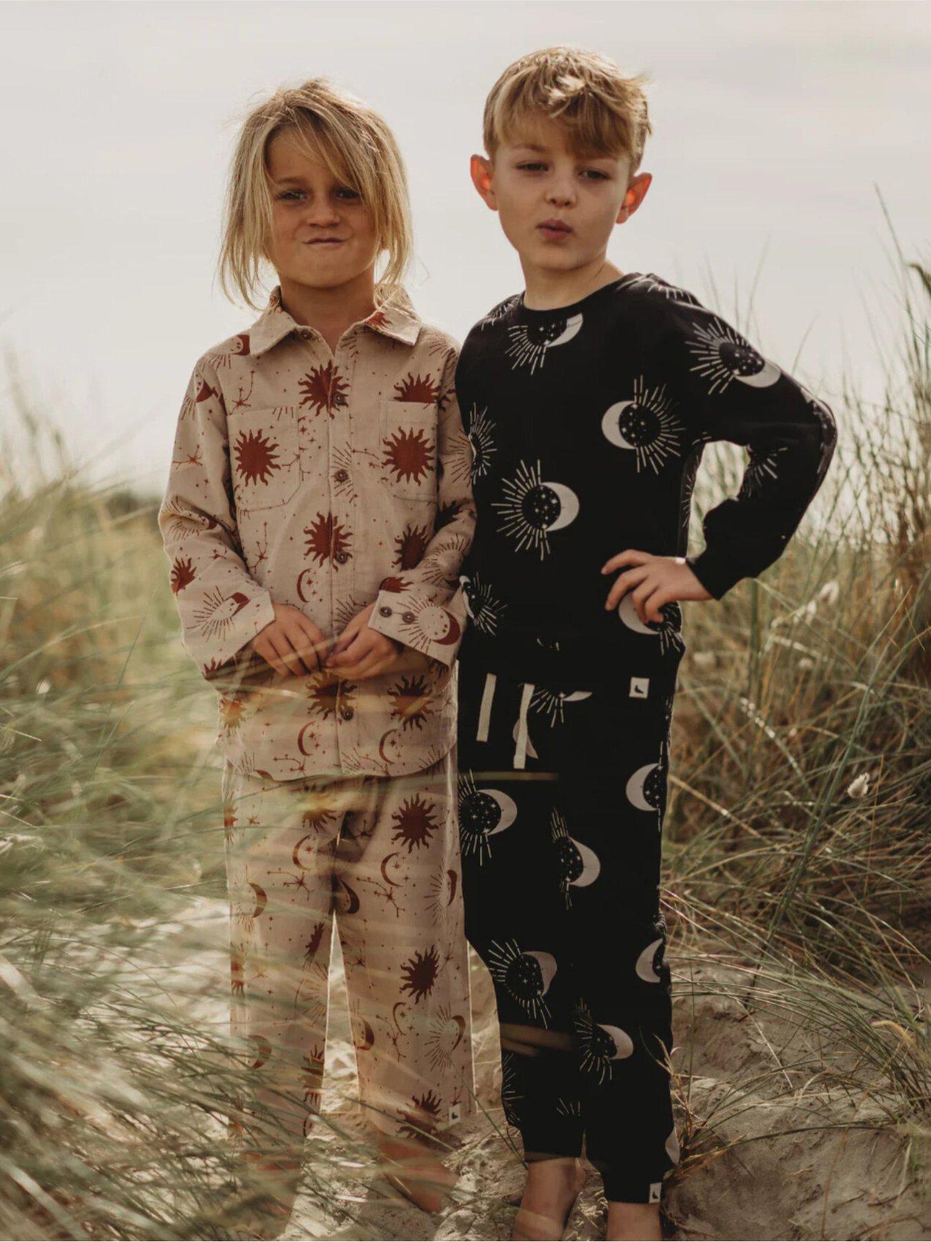 front image of turtledove-london-kids-cotton-celestial-print-joggers-black