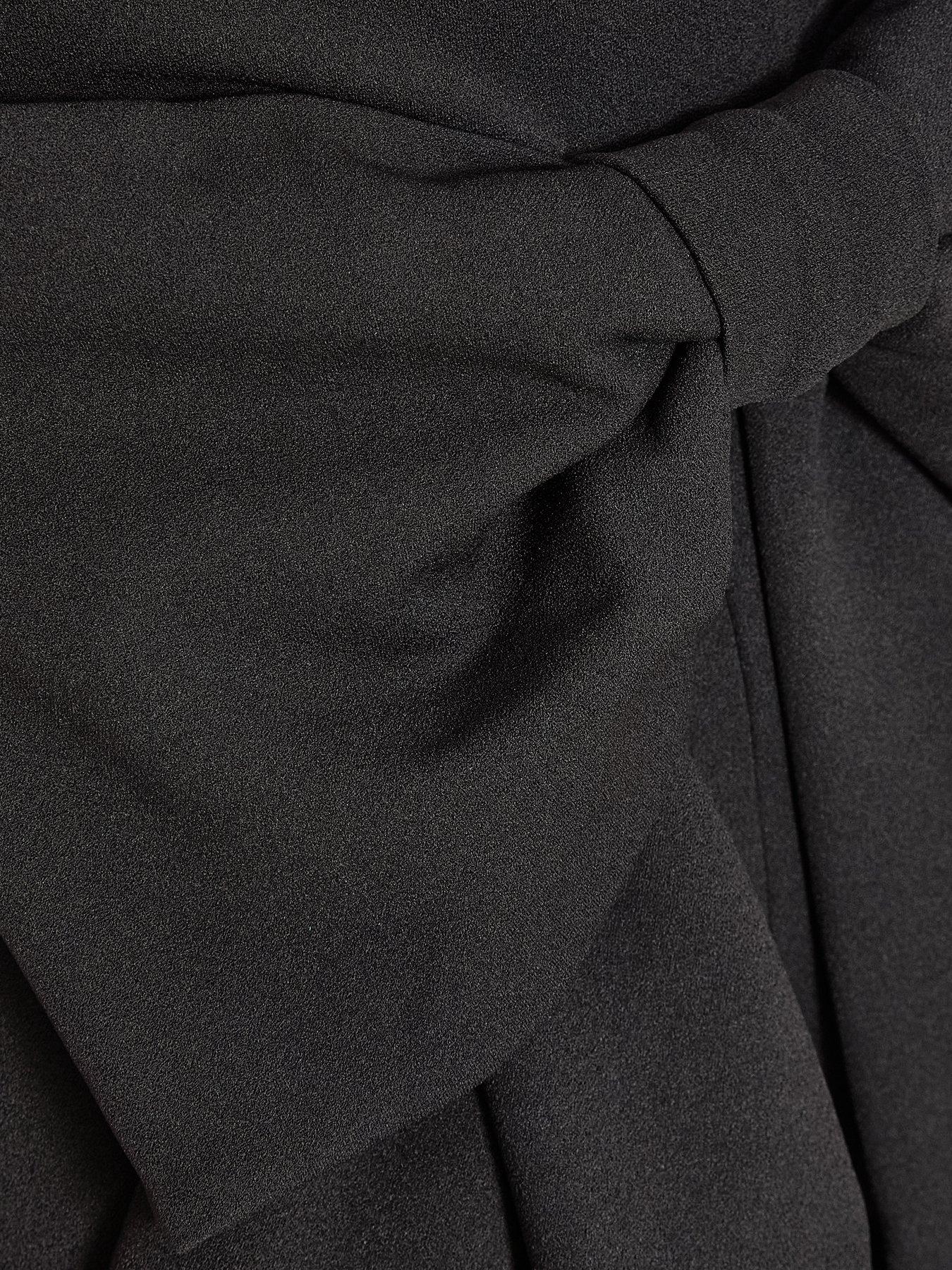  image of quiz-petite-black-bow-back-jumpsuit