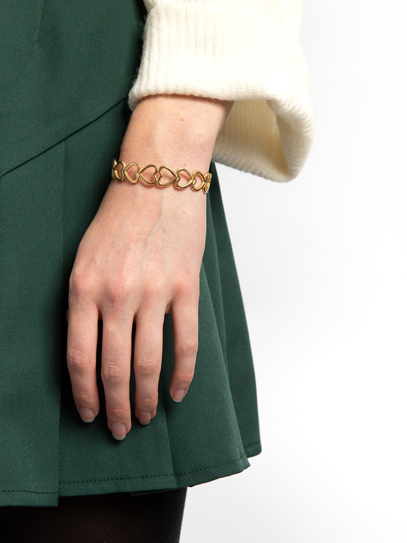 stillFront image of the-love-collection-gold-plated-stainless-steel-linked-heart-bangle