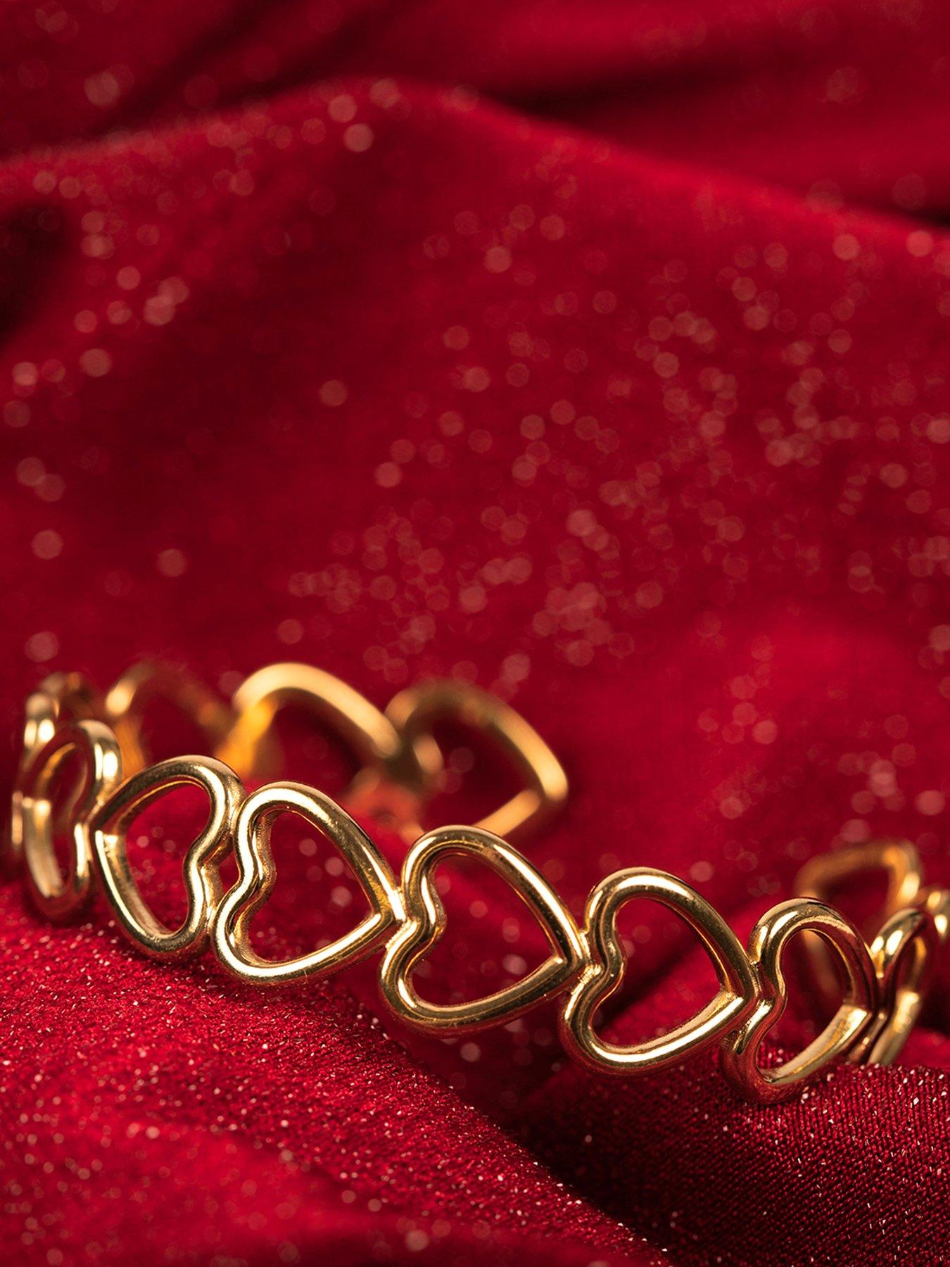  image of the-love-collection-gold-plated-stainless-steel-linked-heart-bangle