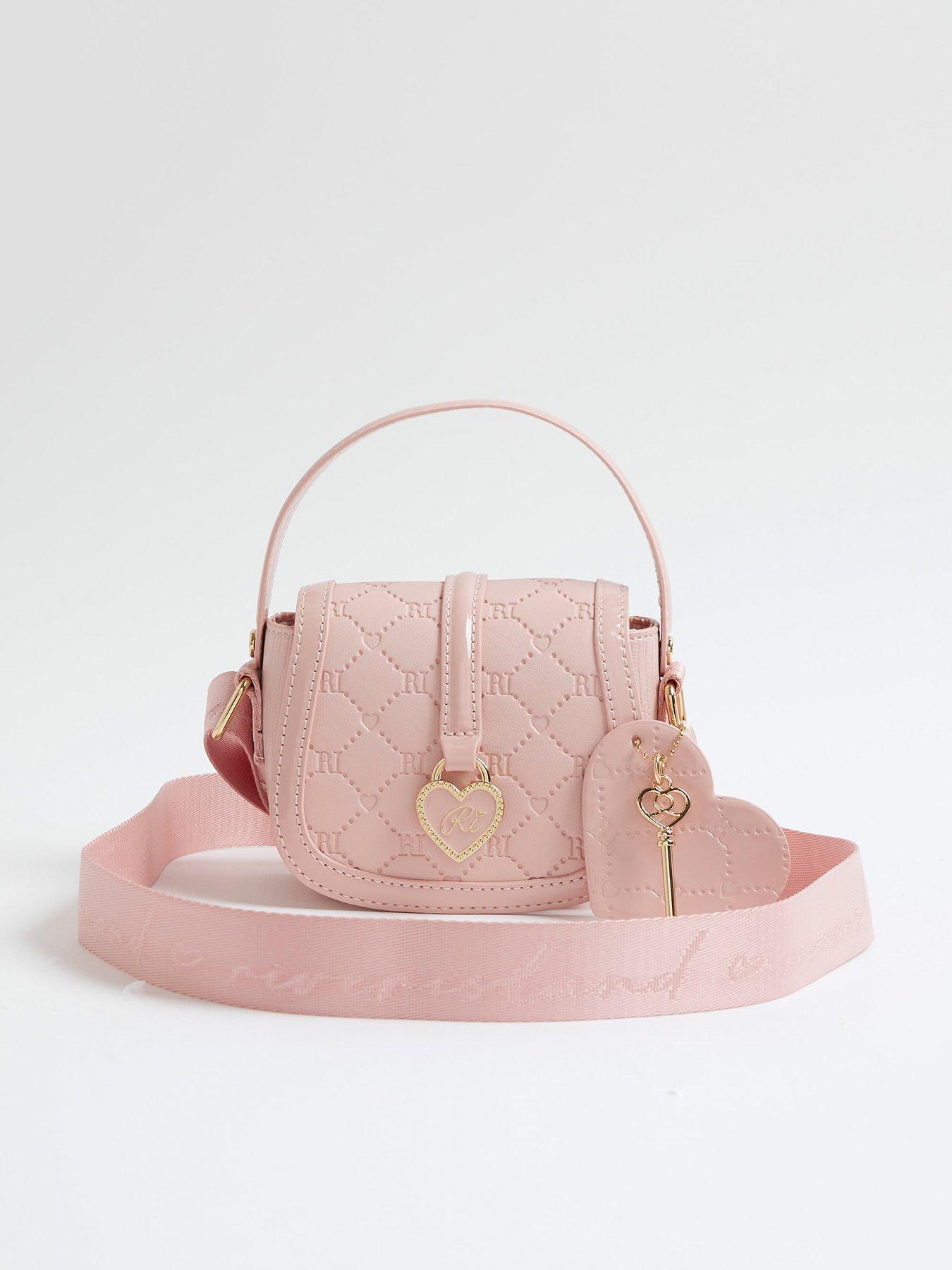 Image 1 of 5 of River Island Older Girls Heart Monogram Cross Body Bag - Pink