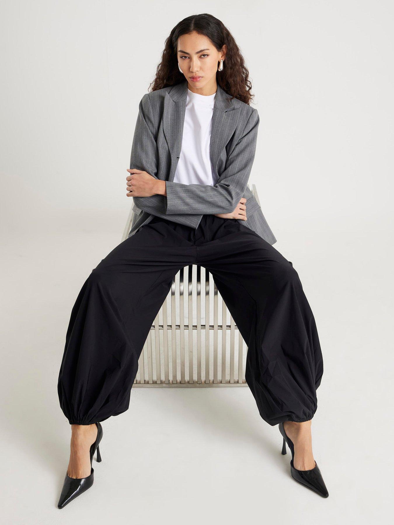 Image 1 of 6 of River Island Technical Balloon Trousers - Black