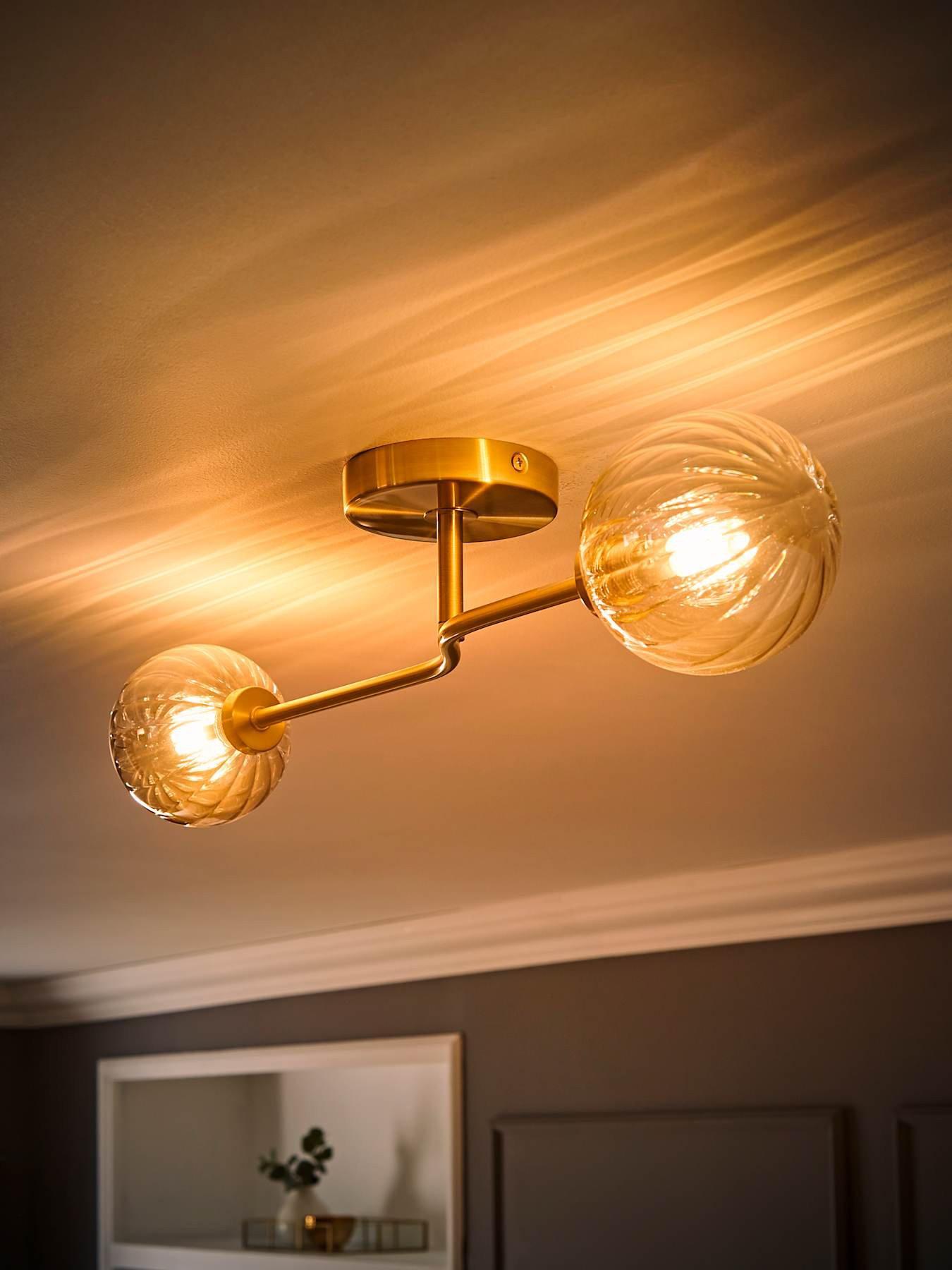 Image 3 of 7 of ValueLights Chessy Gold Metal Bar 2 Way Ceiling Light with Amber Ribbed Glass Globe Shades