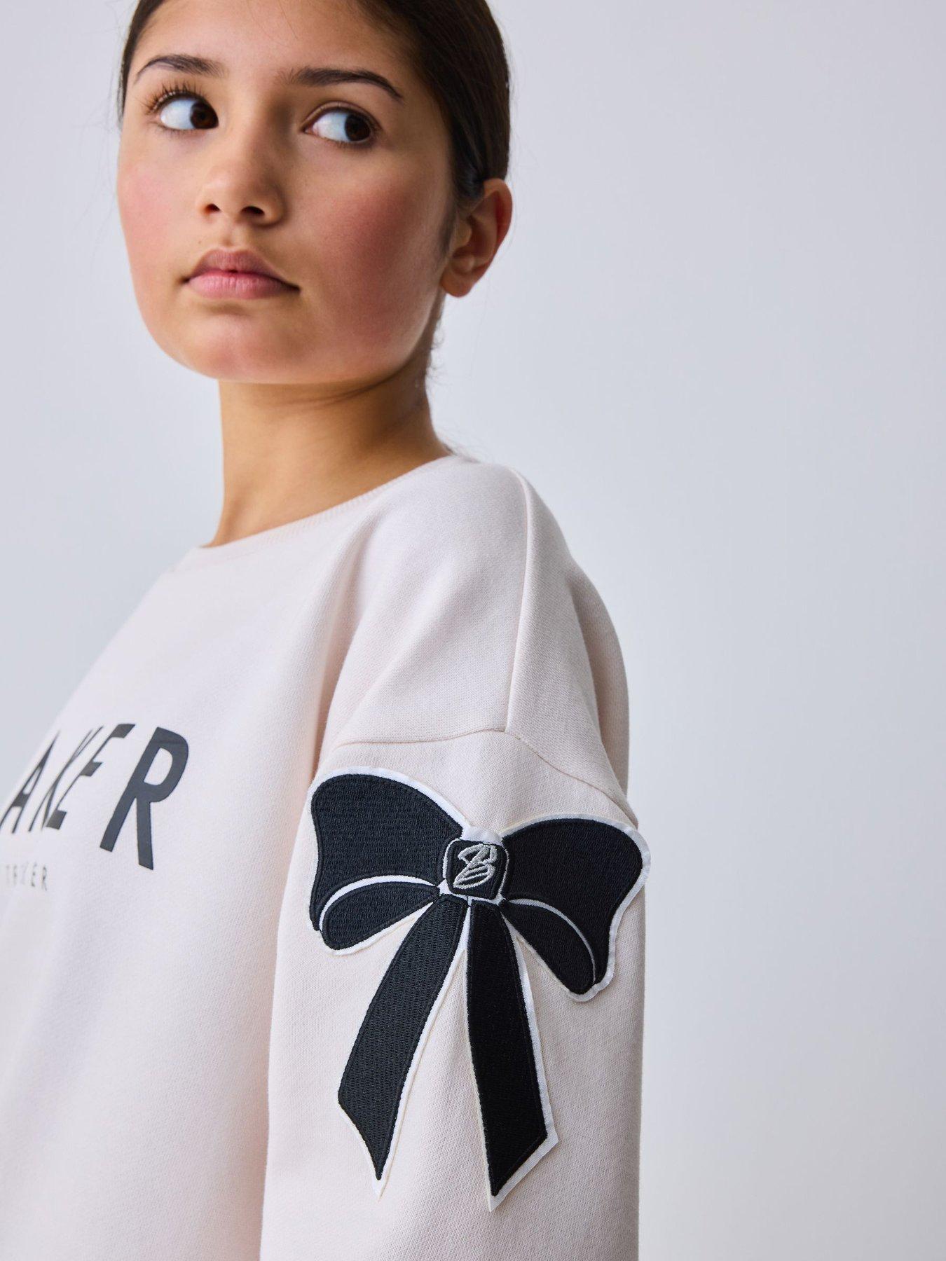 Image 4 of 7 of Ted Baker Girls Bow Detail Long Sleeve Sweatshirt Top and Split Hem Joggers Set - Cream