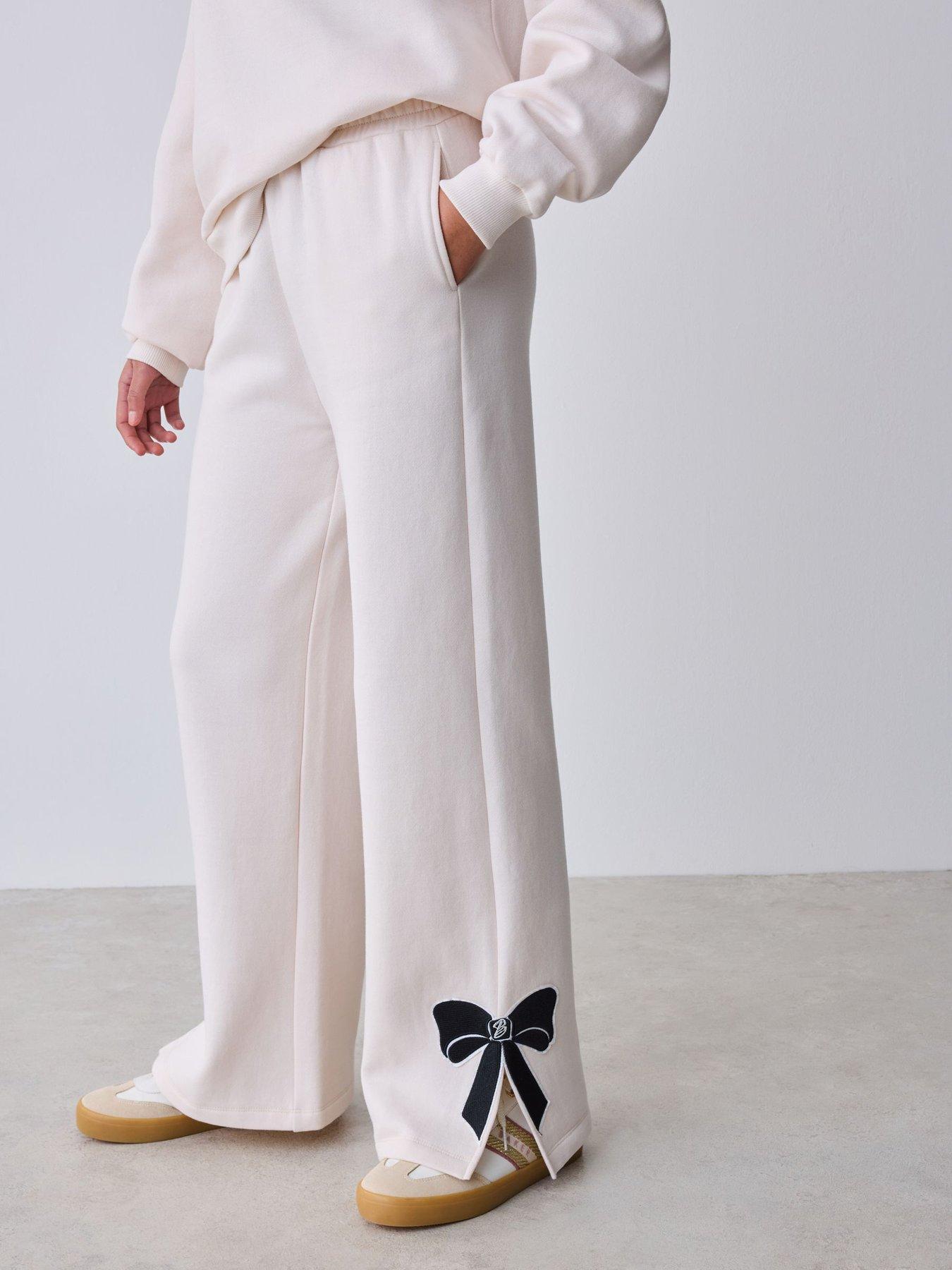 Image 5 of 7 of Ted Baker Girls Bow Detail Long Sleeve Sweatshirt Top and Split Hem Joggers Set - Cream
