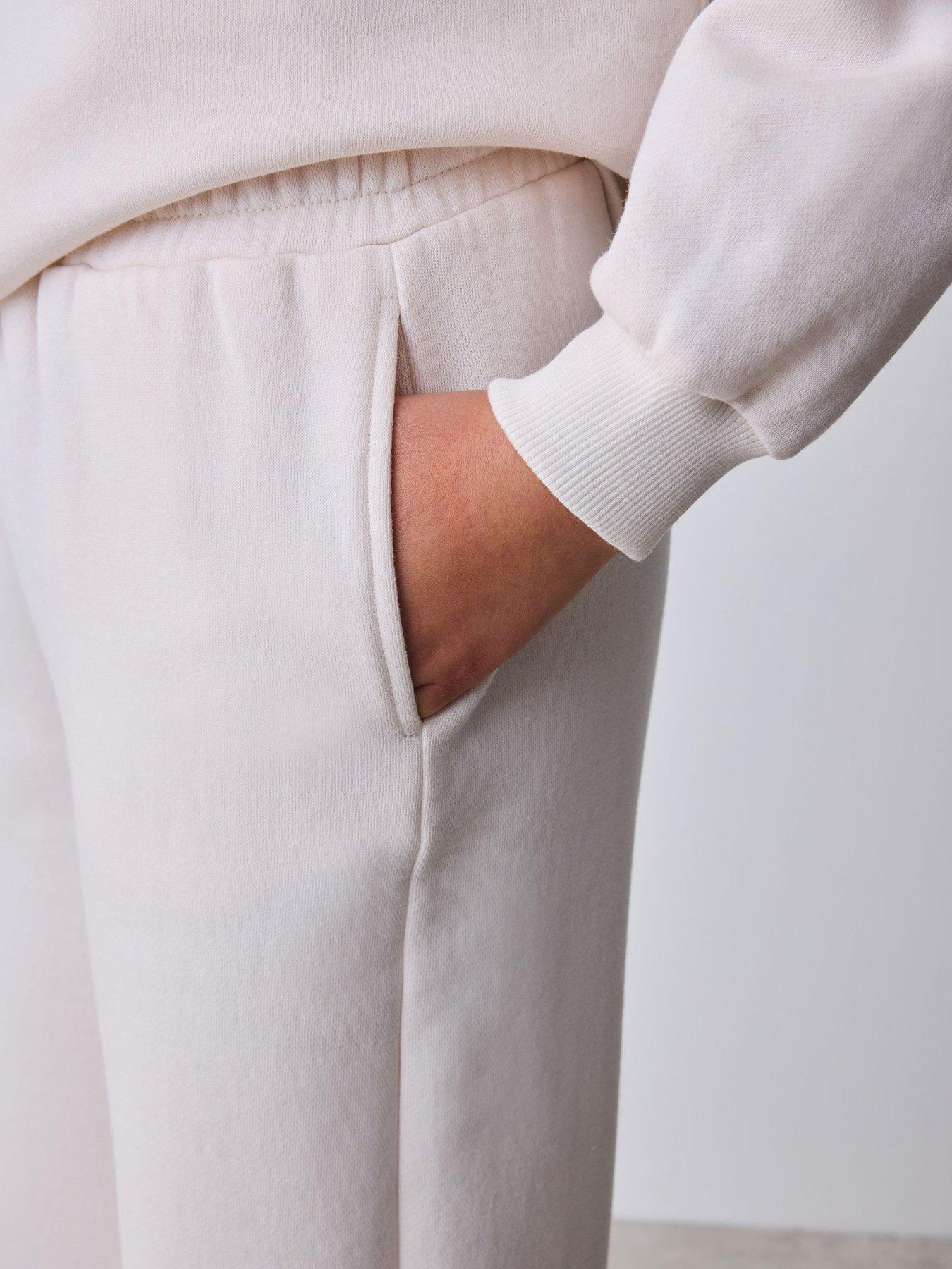 Image 7 of 7 of Ted Baker Girls Bow Detail Long Sleeve Sweatshirt Top and Split Hem Joggers Set - Cream