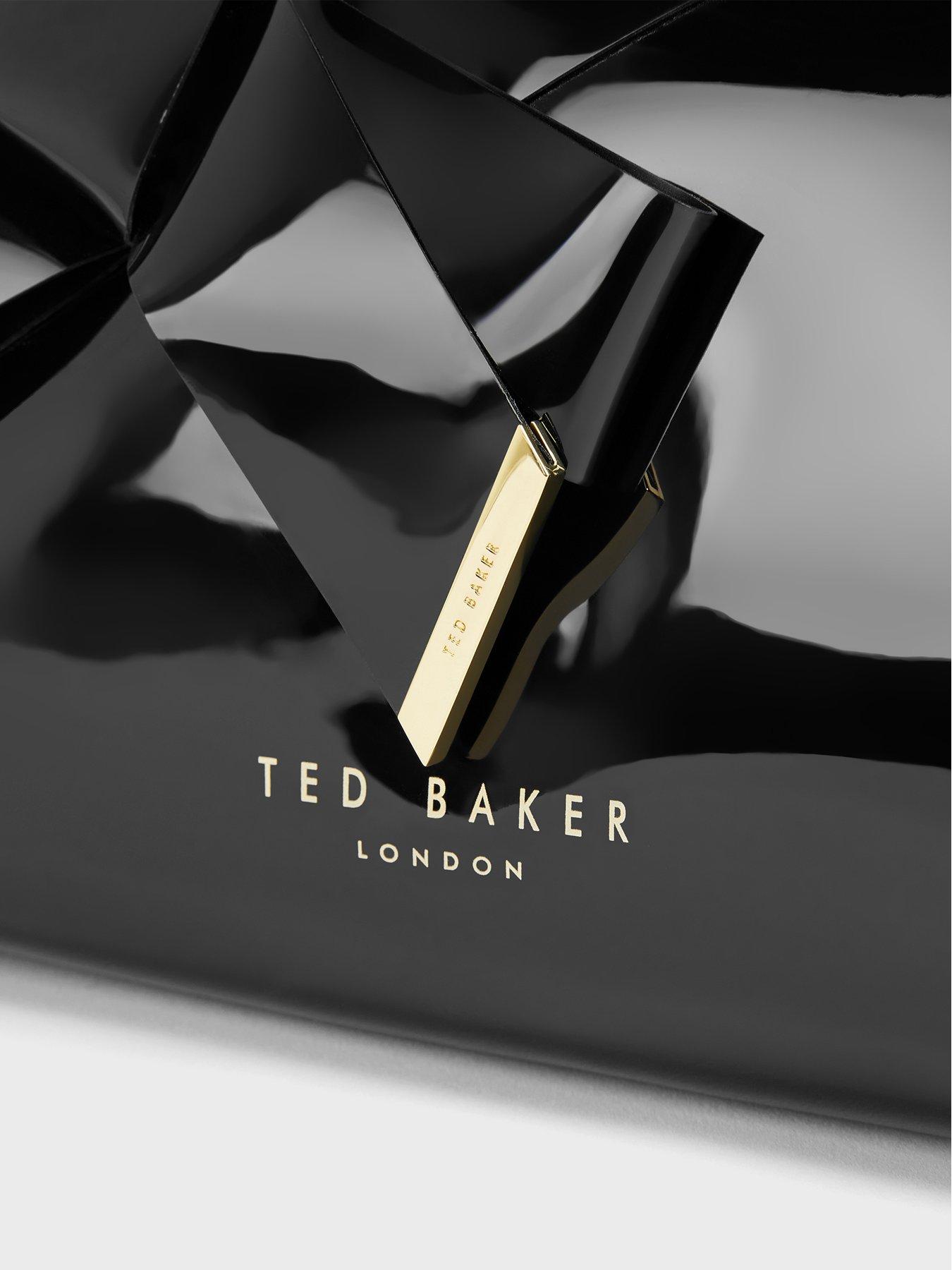  image of ted-baker-bow-patent-make-up-bag-black