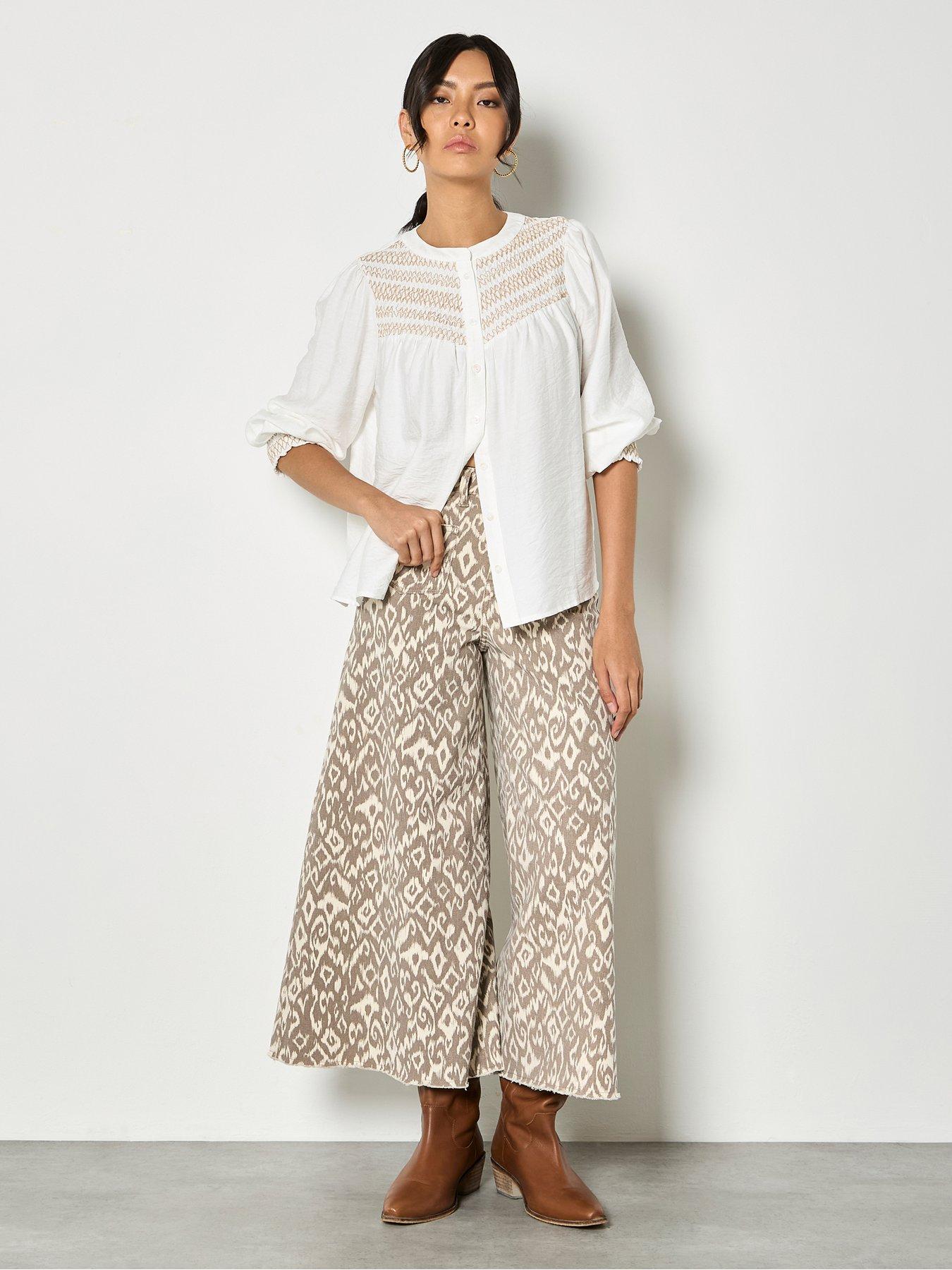  image of apricot-wavy-embroidered-smocked-blouse