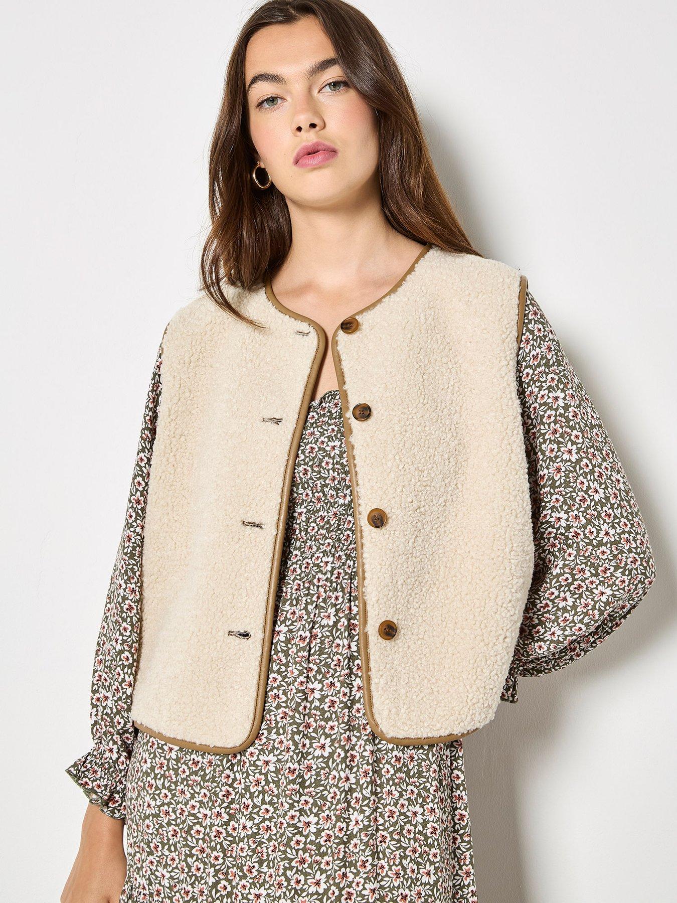  image of apricot-reversible-borg-suede-gilet