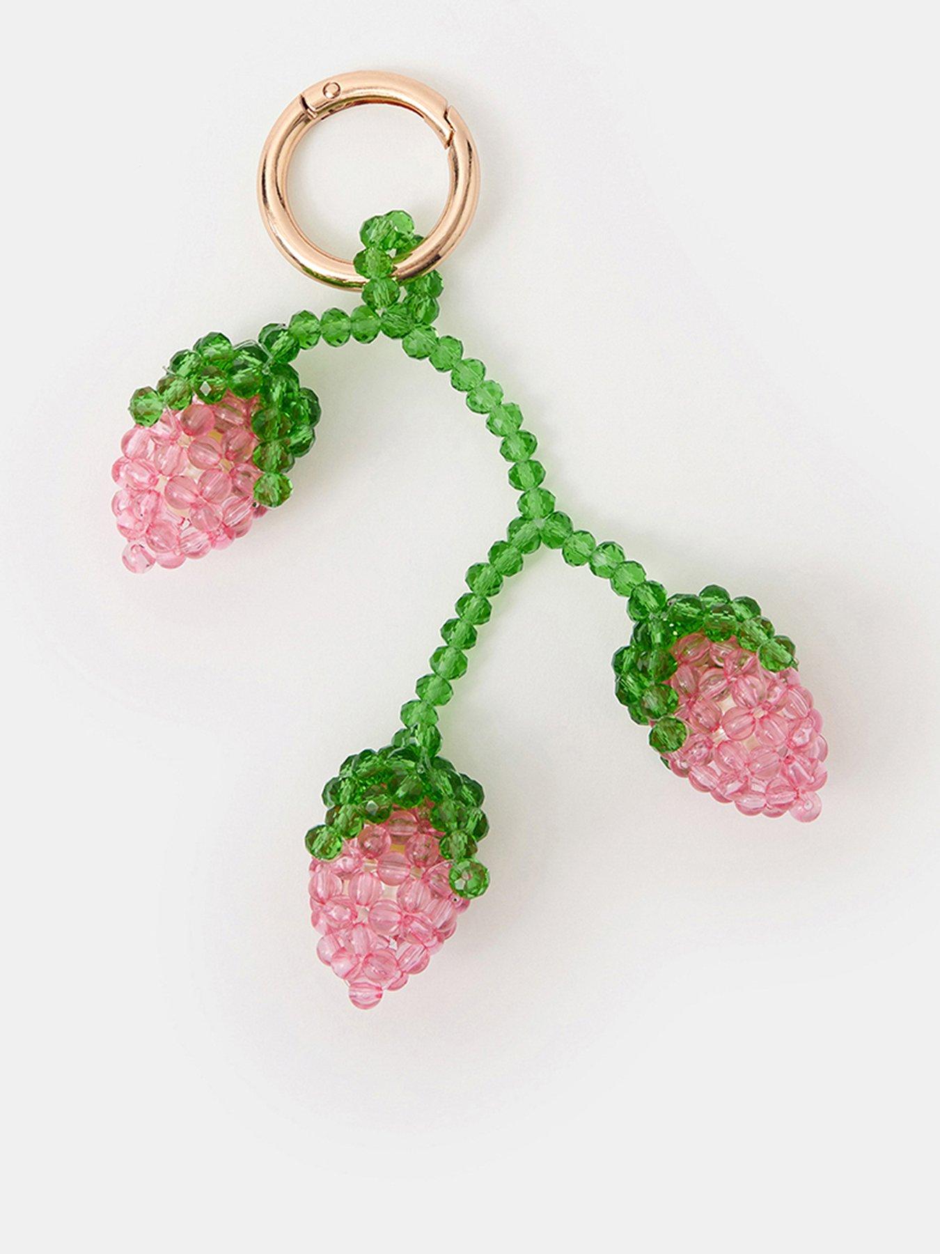Image 1 of 4 of Accessorize Strawberry Beaded Bag Charm - Pink