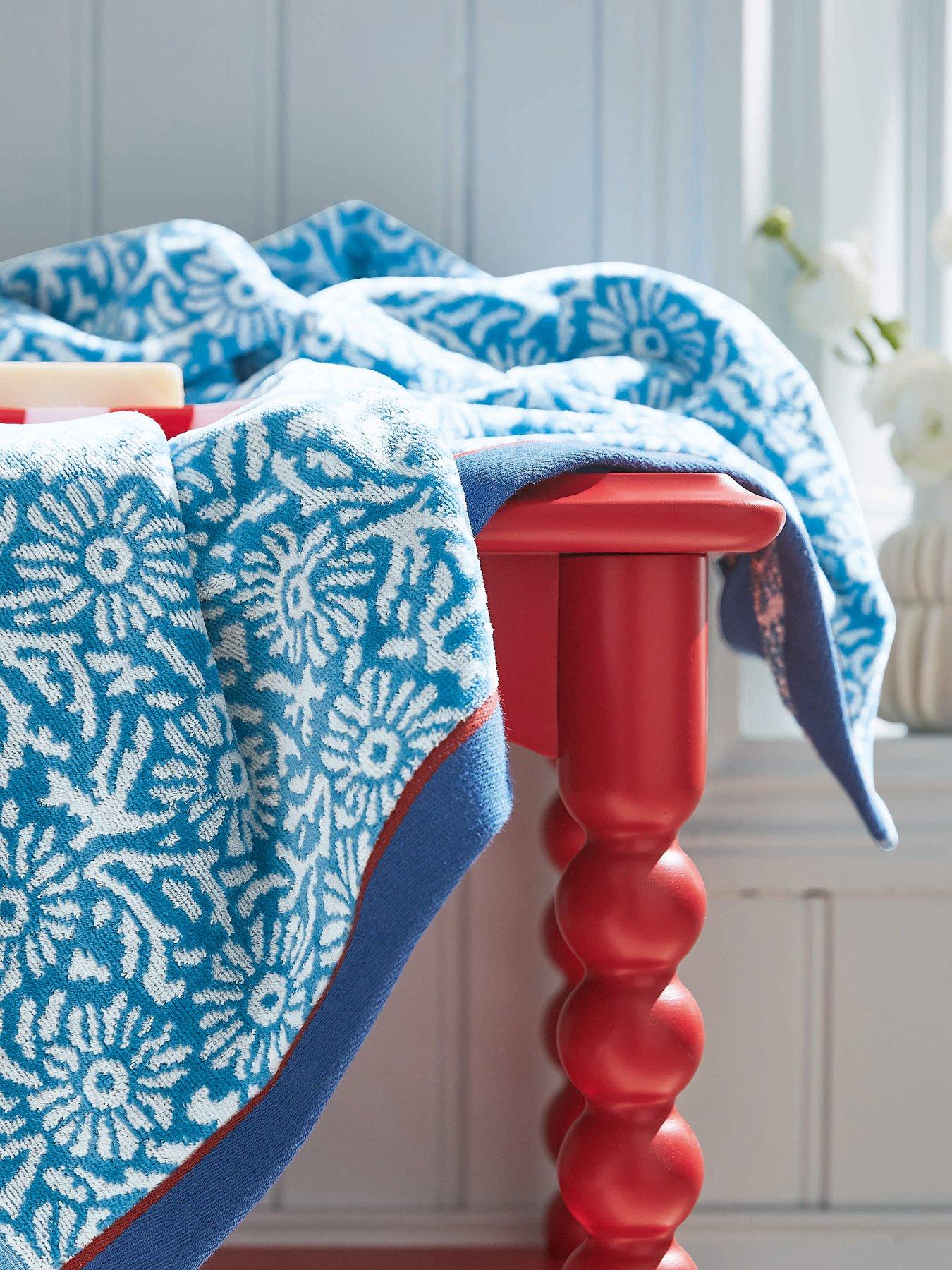 front image of land-shore-aster-hand-towel-blue-red