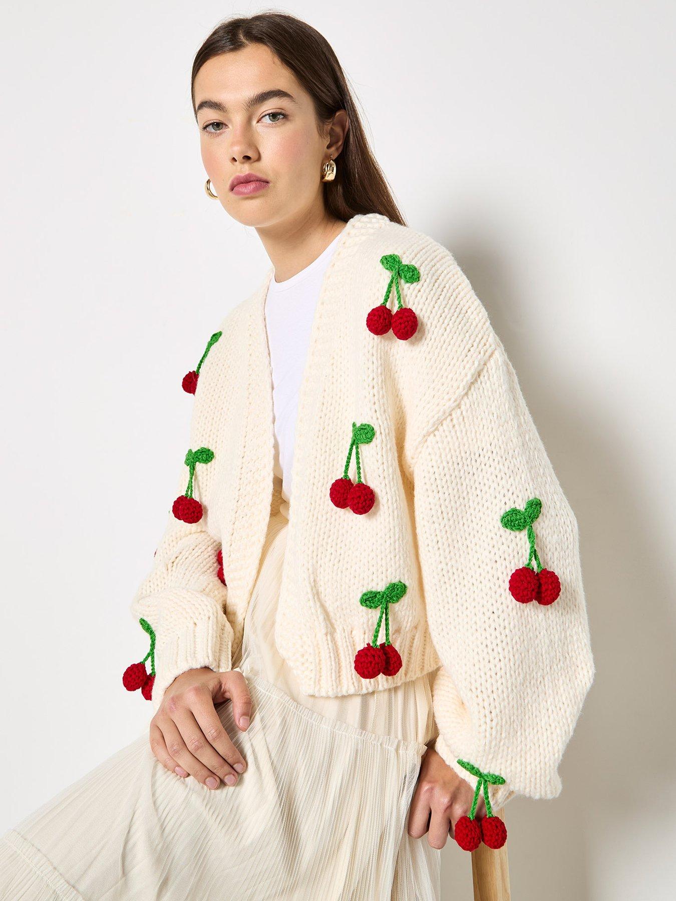  image of apricot-knitted-cherries-open-cardigan-cream