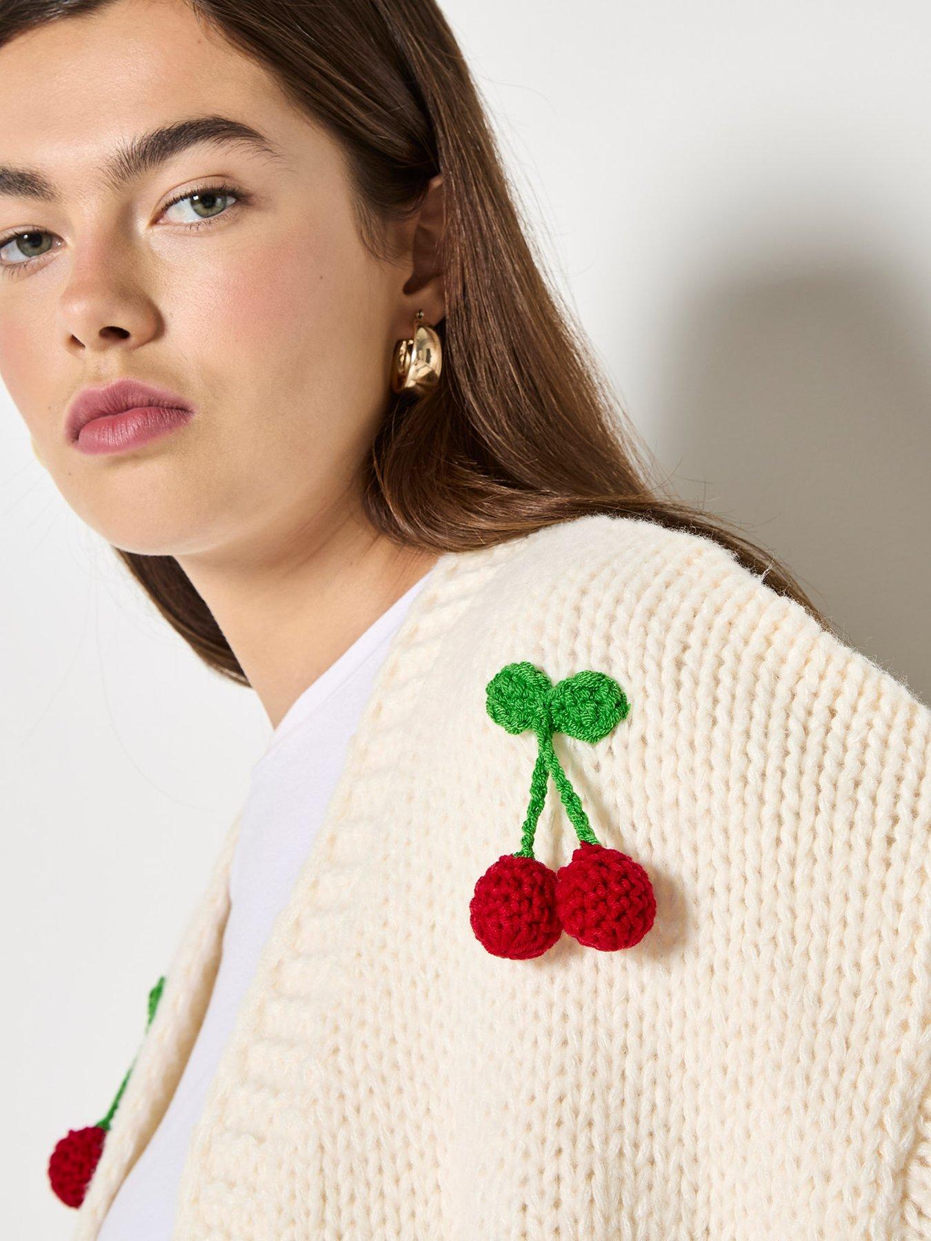  image of apricot-knitted-cherries-open-cardigan-cream