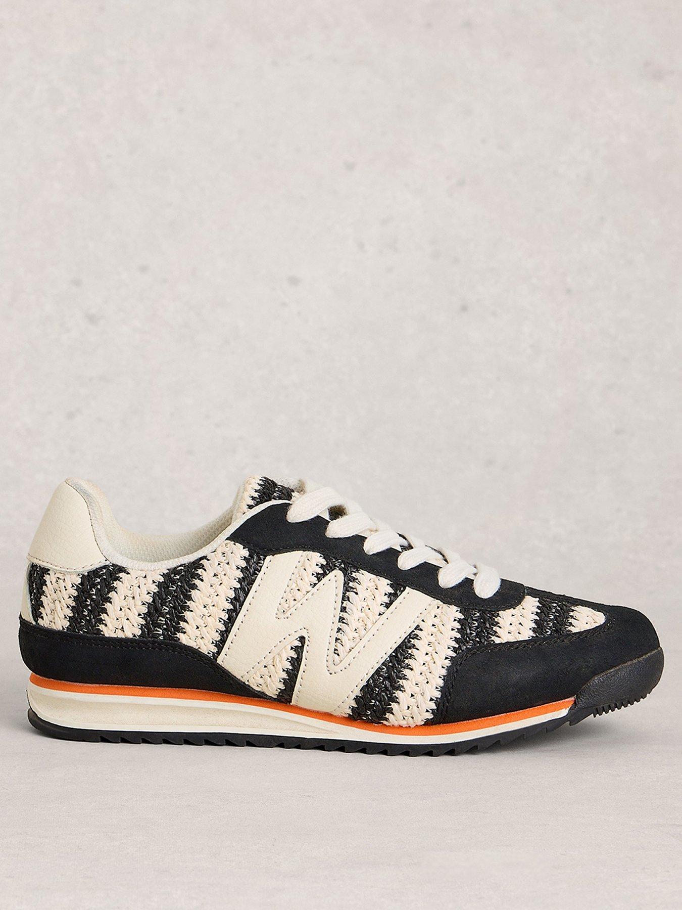front image of white-stuff-lucy-trainer-black