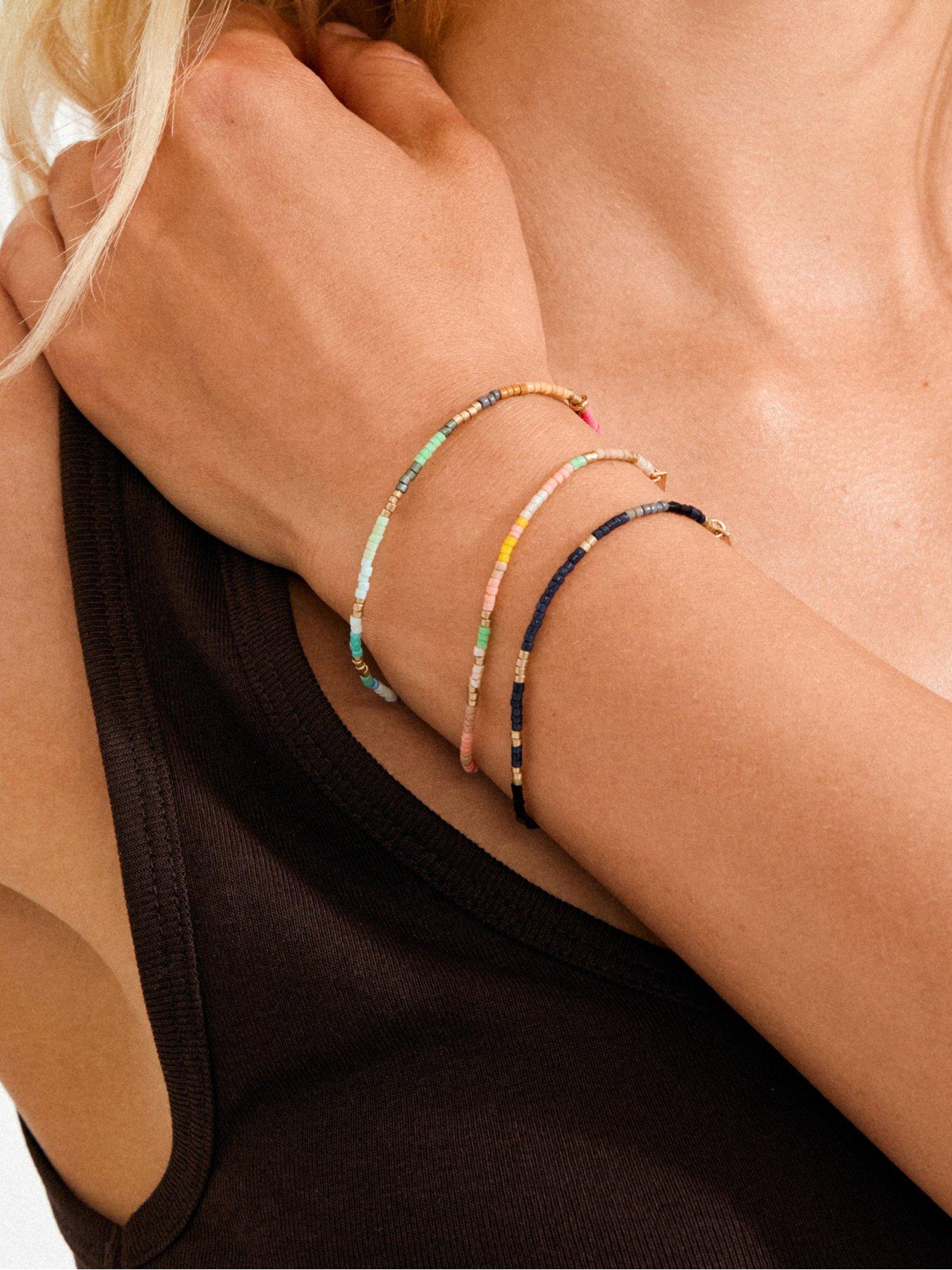  image of pilgrim-alison-bracelet-black-gold-plated