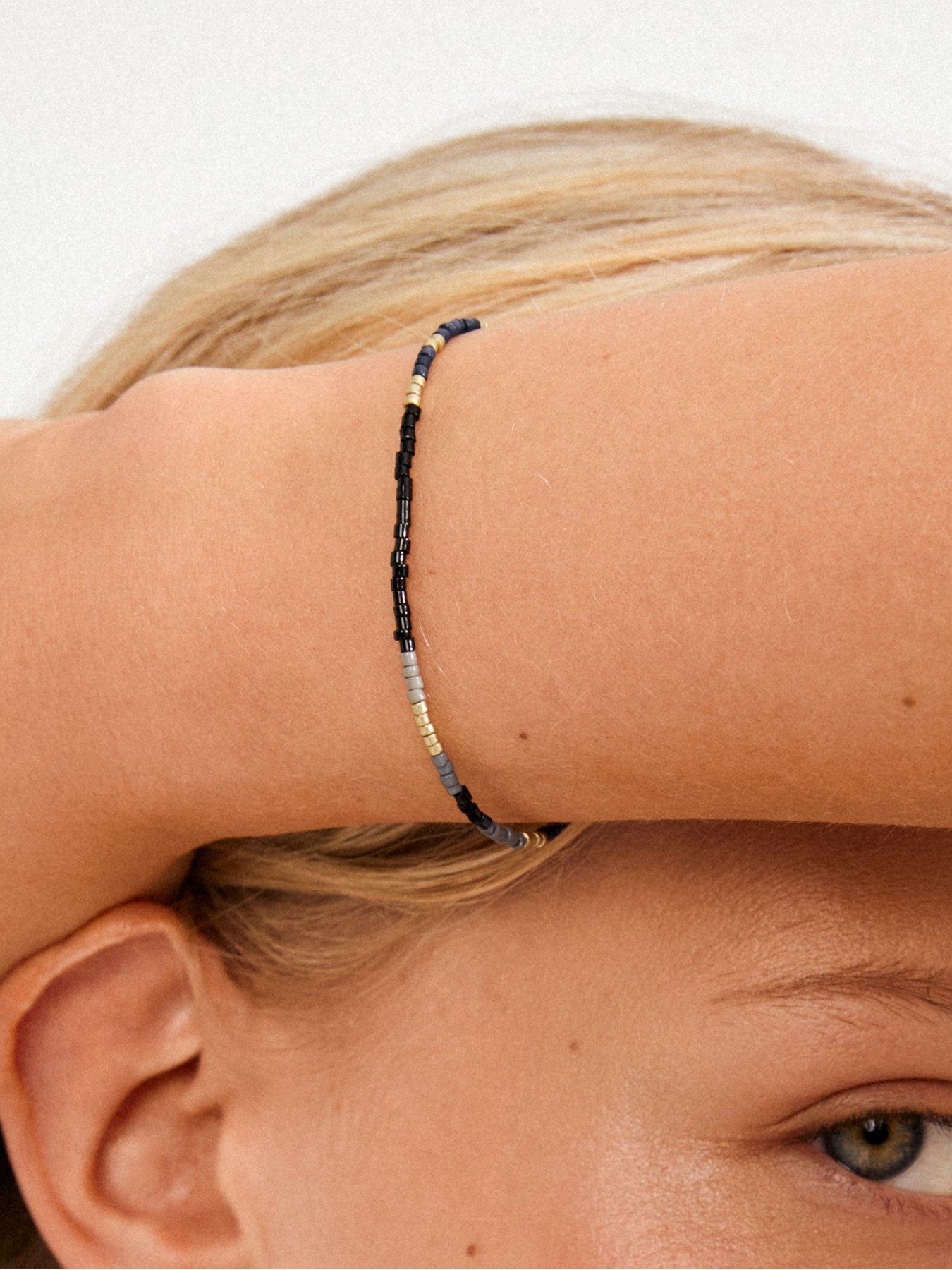  image of pilgrim-alison-bracelet-black-gold-plated