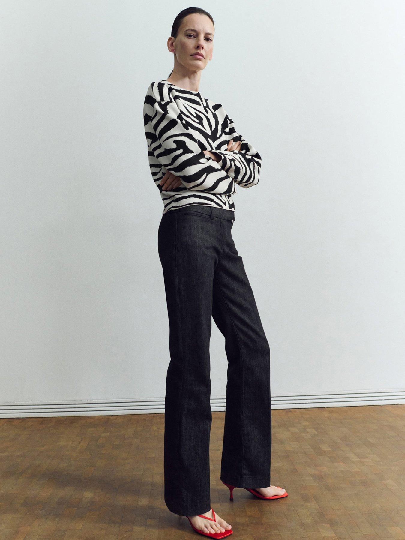  image of mango-zebra-print-knitted-jumper-black
