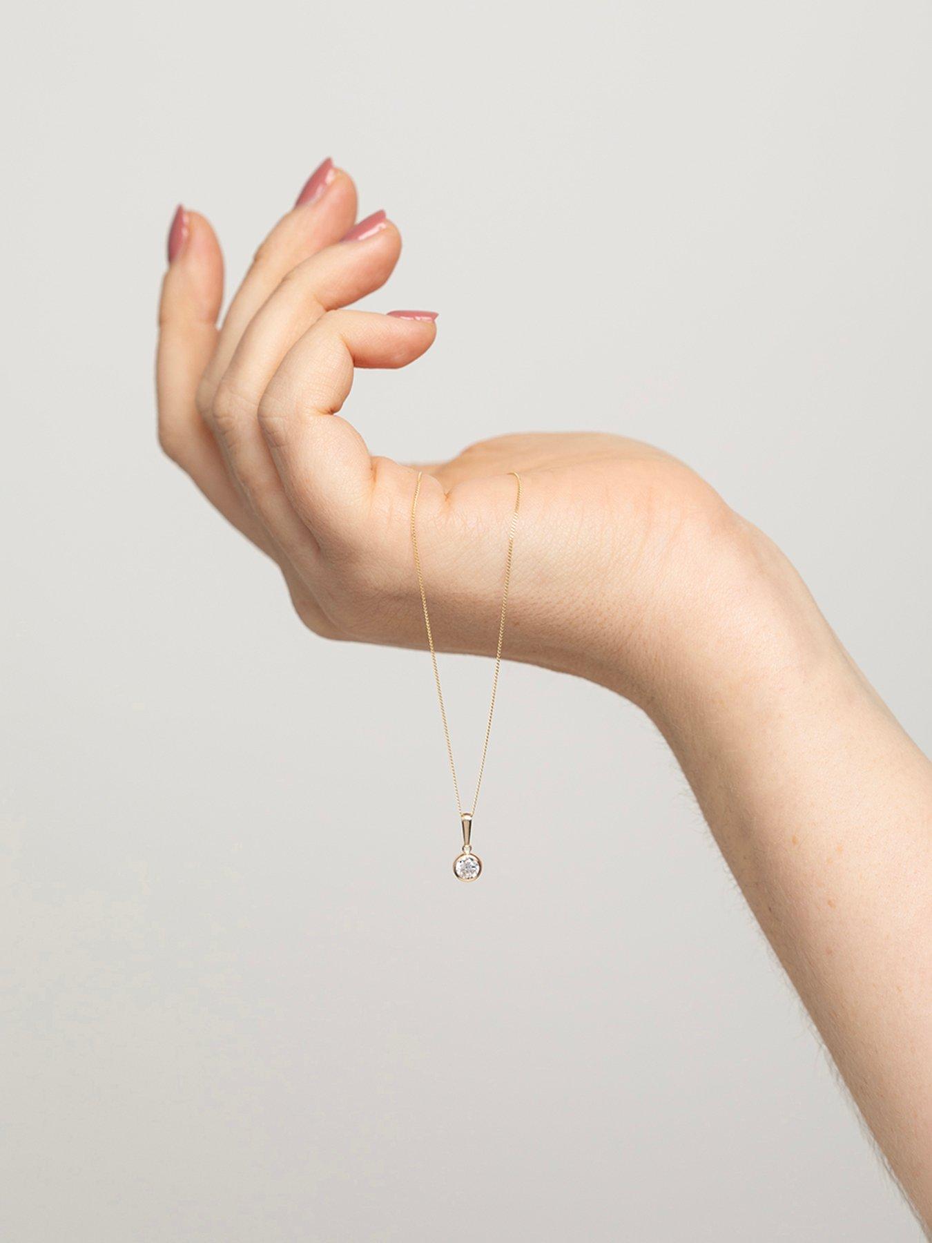  image of the-love-collection-9ct-yellow-gold-white-cz-rubover-pendant