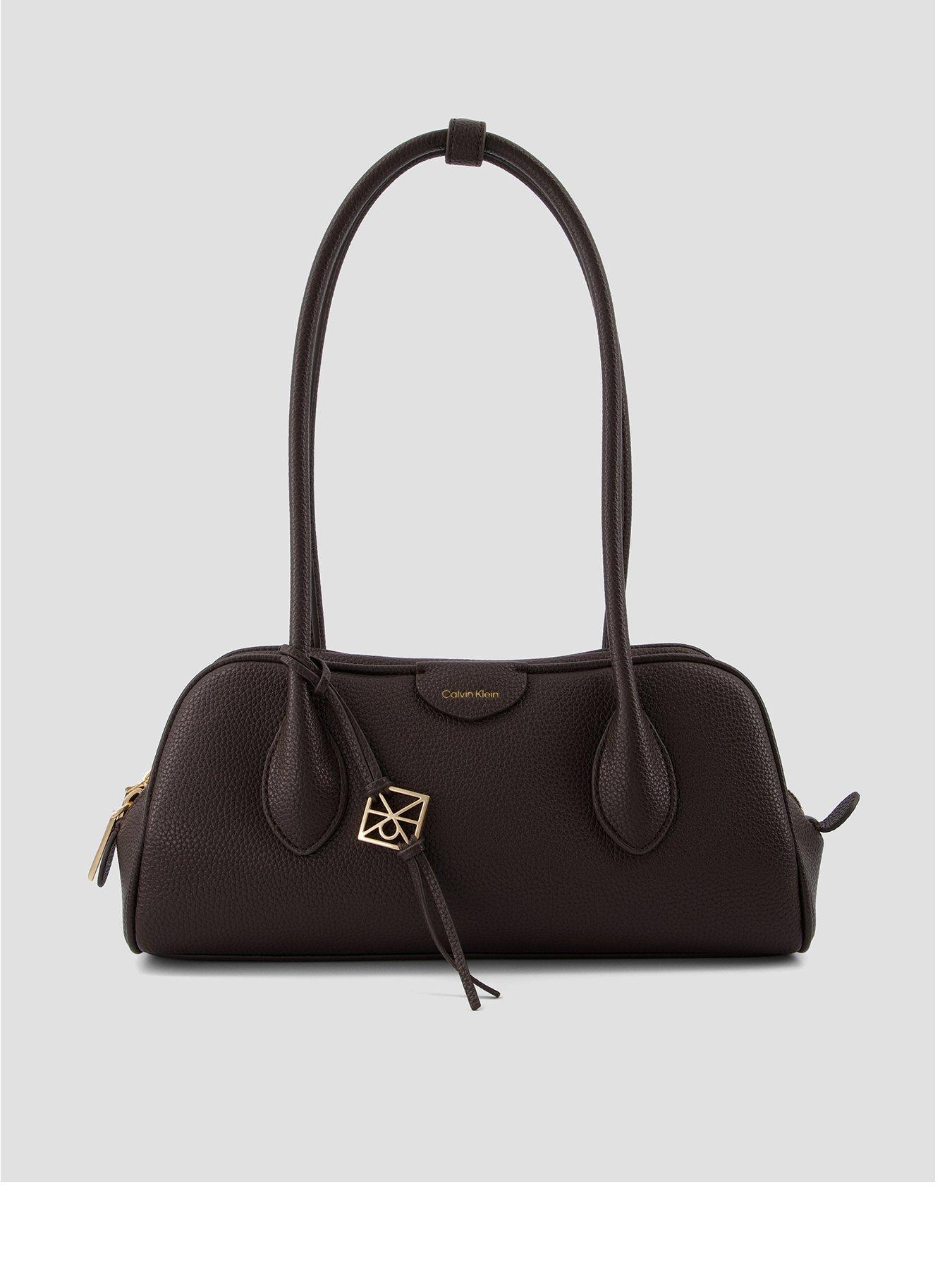 Image 1 of 4 of Calvin Klein Emblem Pebble Grain Extended Side Shoulder Bag - Brown