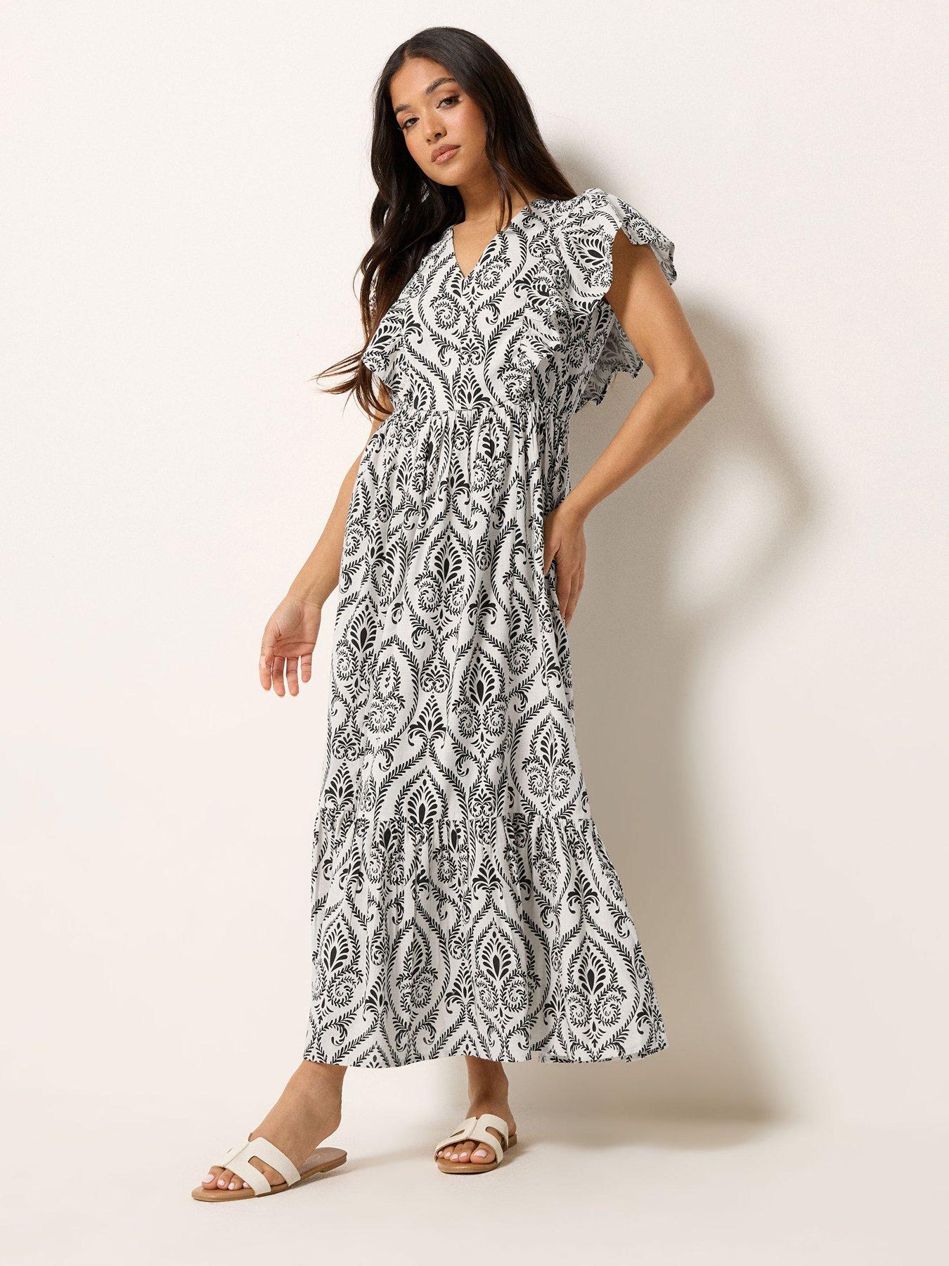 Image 1 of 5 of PixieGirl Petite Frill Print Maxi Dress - White