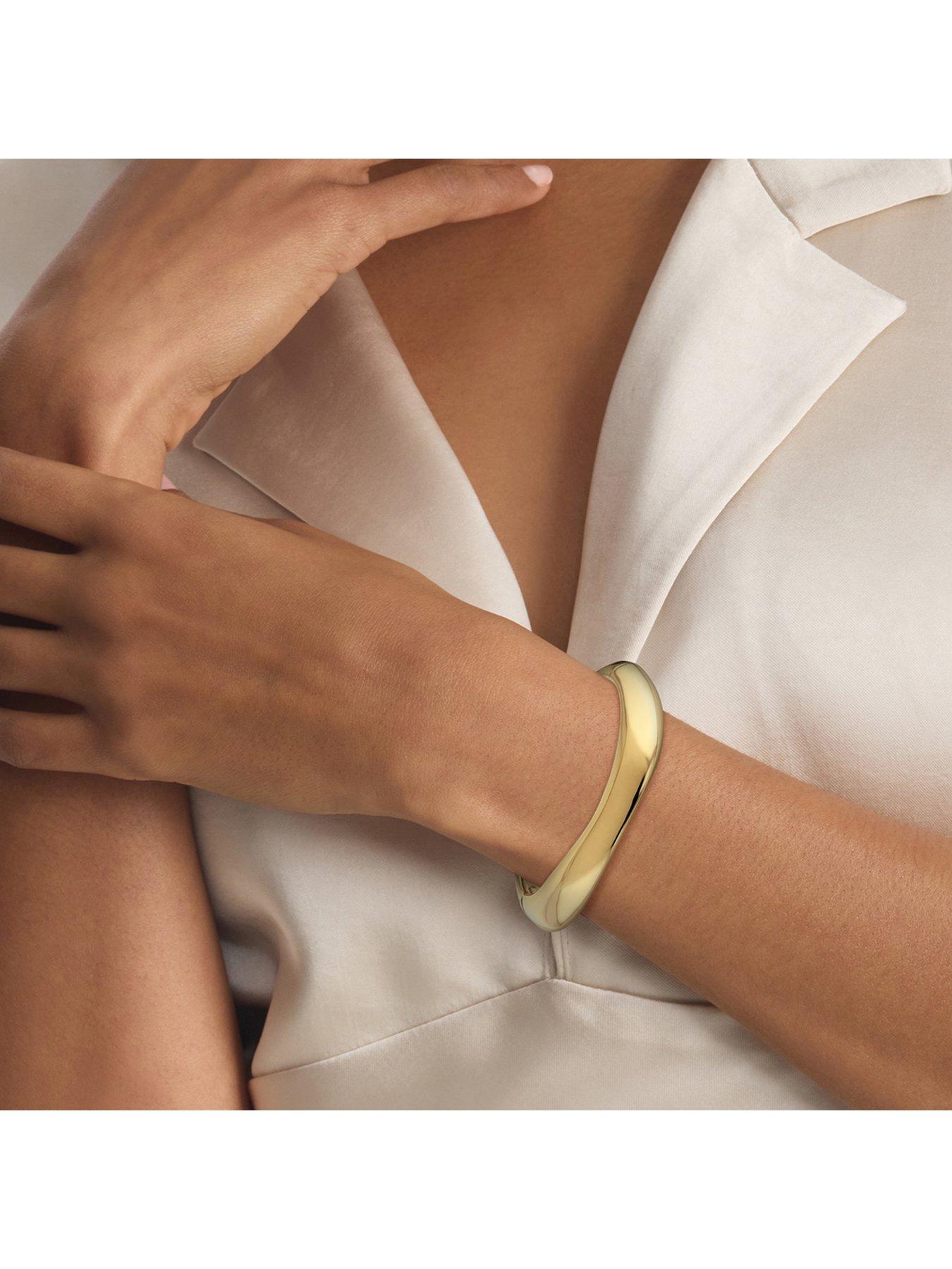  image of calvin-klein-womens-ck-sculpted-gold-plated-bangle