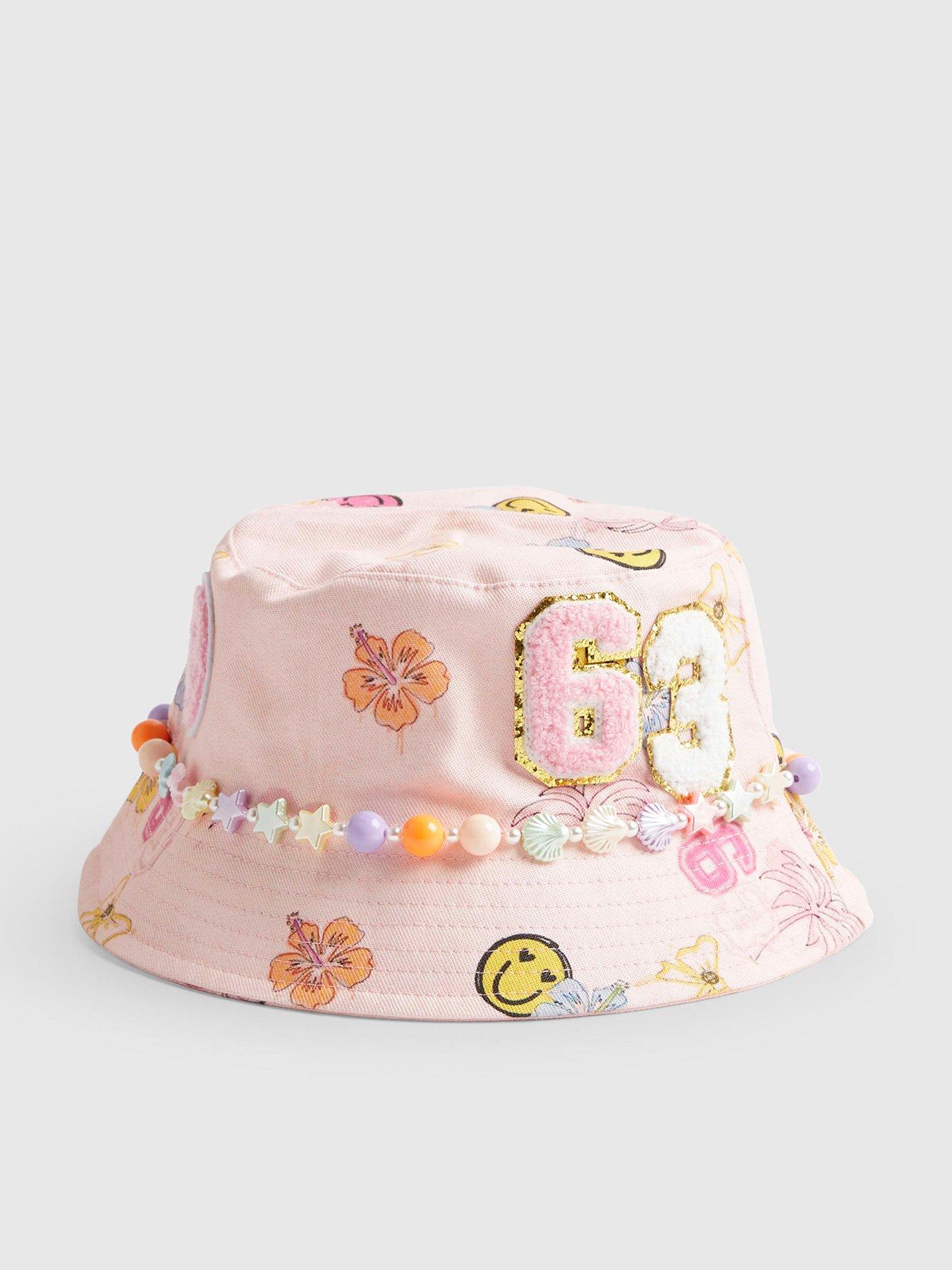 Image 1 of 4 of River Island Older Girls Graffiti Beaded Bucket Hat - Pink