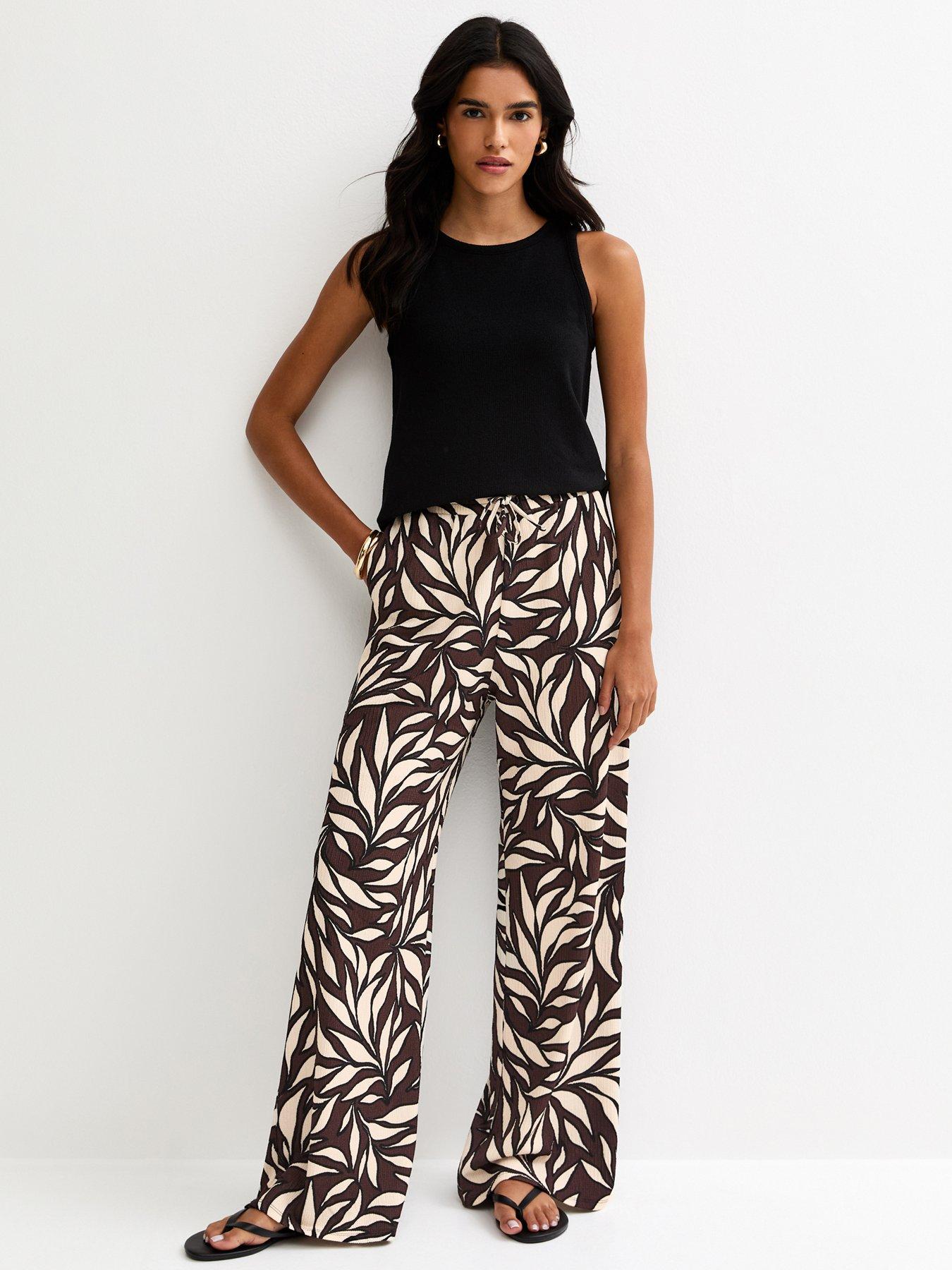 Image 1 of 5 of New Look Brown Leaf Print Crinkle Texture Wide Leg Trousers