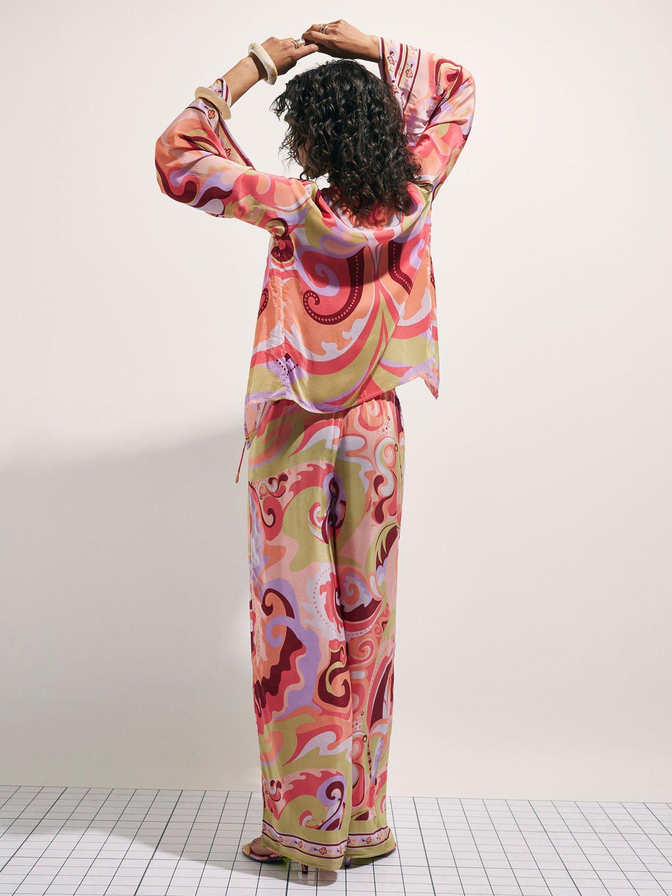 Image 2 of 4 of River Island Terry De Havilland Swirl Print Trouser - Orange