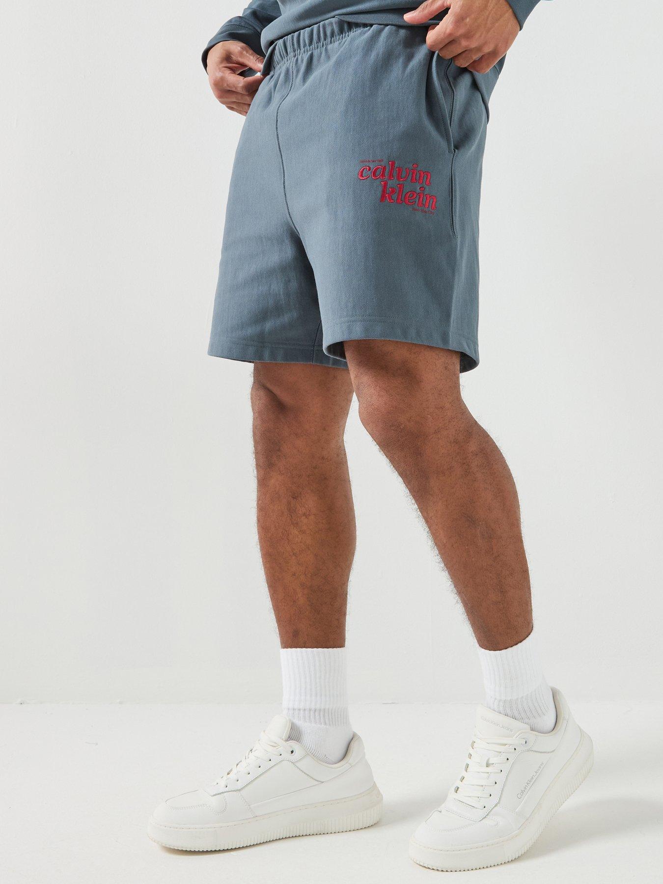 Image 1 of 6 of Calvin Klein Jeans Premium Terry Graphic Sweat Short - Dark Green
