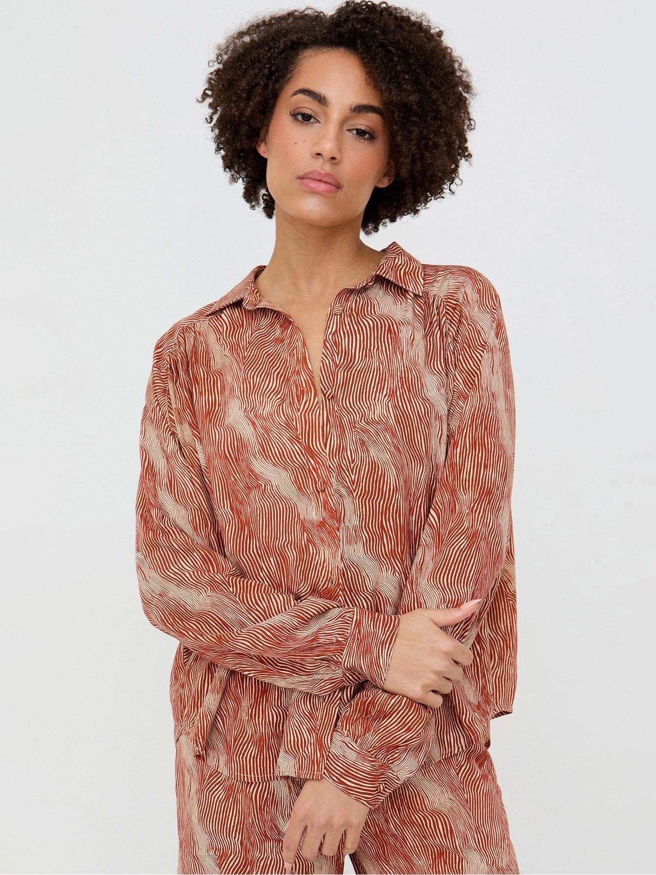 front image of raffya-ginger-button-down-tiger-print-shirt-in-ginger-orange