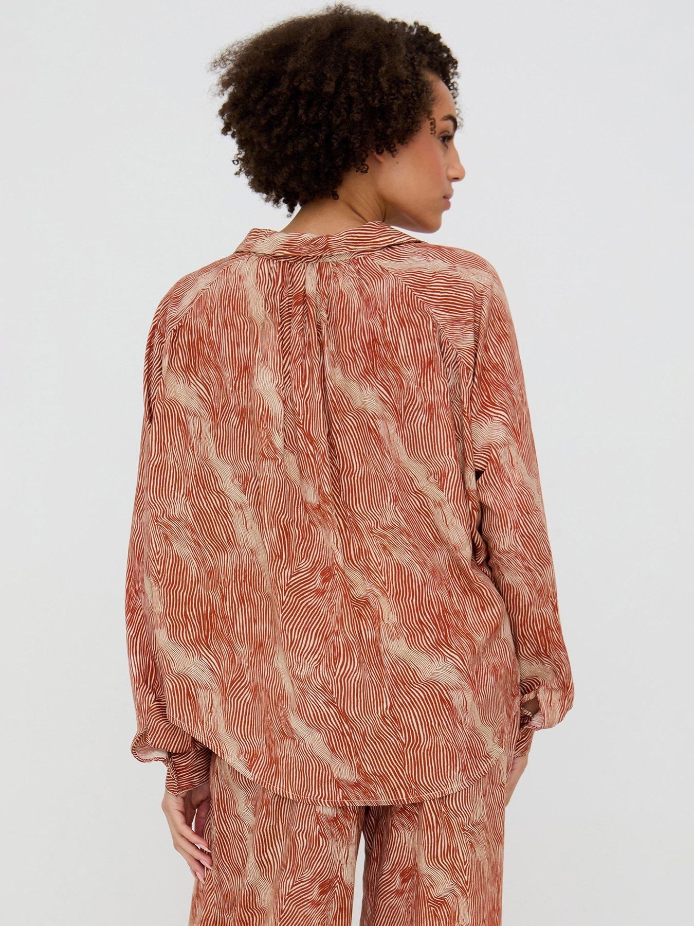  image of raffya-ginger-button-down-tiger-print-shirt-in-ginger-orange